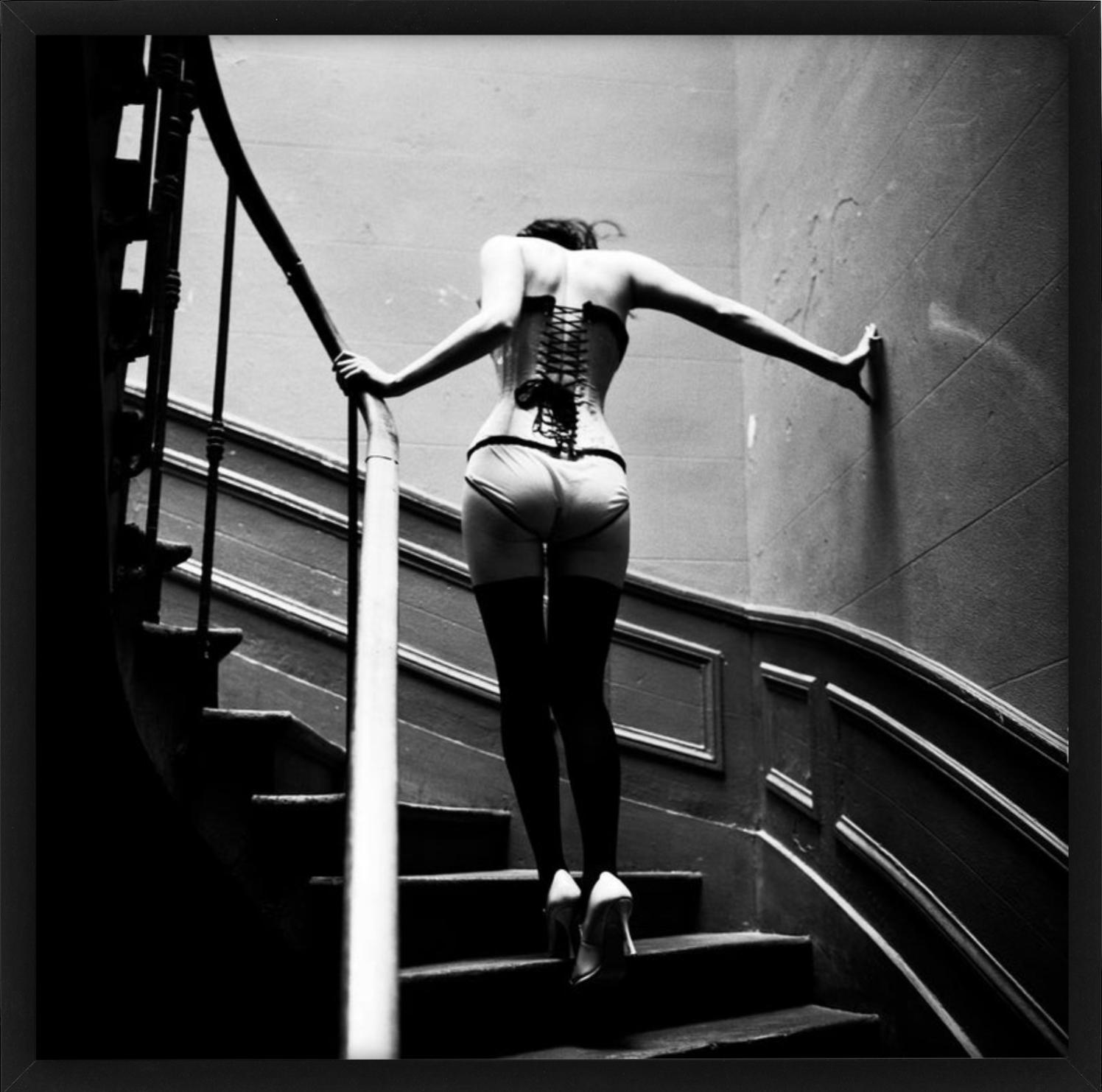 Upstairs, Paris - Model in Lingerie walking up Stairs, fine art photography 1996 - Black Black and White Photograph by Ellen von Unwerth