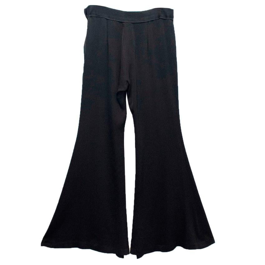 Ellery black valley curtain wide leg flare trousers. Satin Crepe feel. Mid waist fit. Zipper closure down the side with button closure. Light weight material. 

Size UK 10
Generous fit, fits more like a UK 12, refer to measurements.