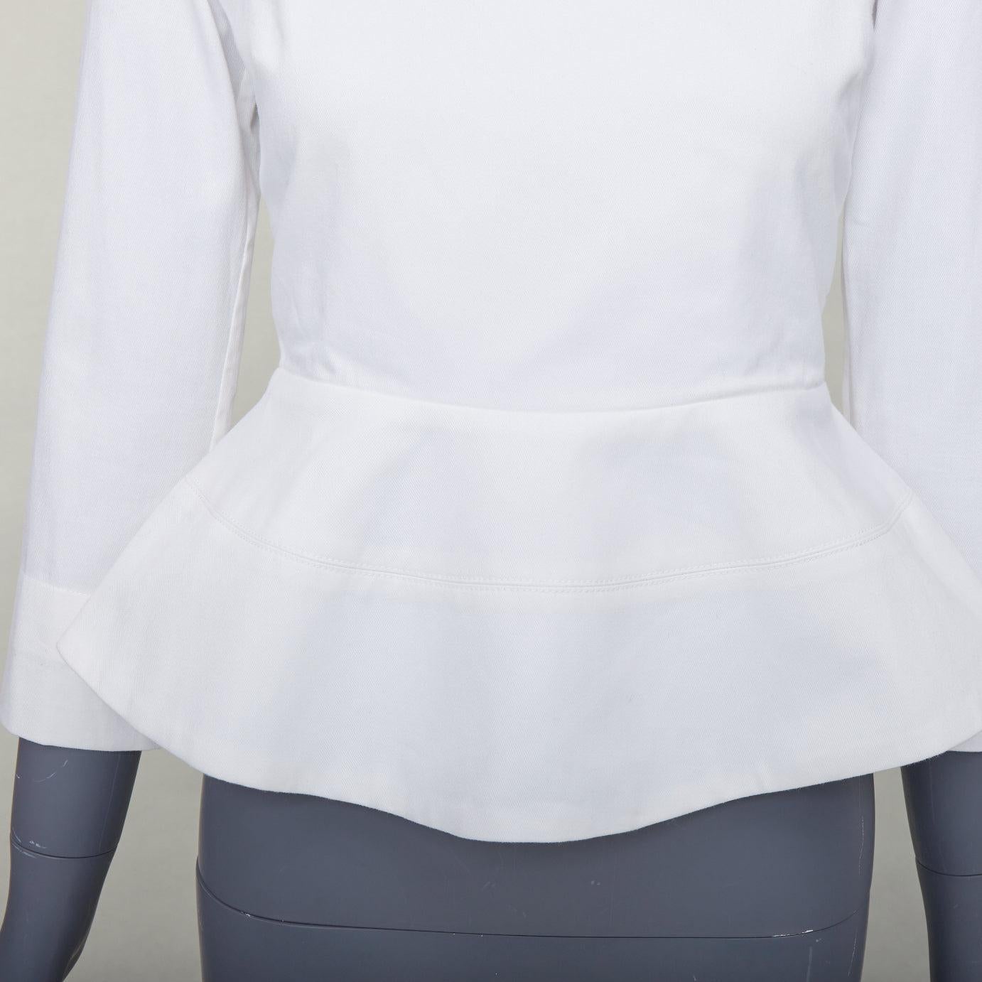 ELLERY Manzoni top blanco con cuello redondo y peplum de sarga de algodón US6 M
Referencia: SNKO/A00660
Marca: Ellery
Model No: Manzoni
Material: Algodón
Color: crema
Patrón: Sólido
Cierre: cremallera
Detalles adicionales: Cremallera