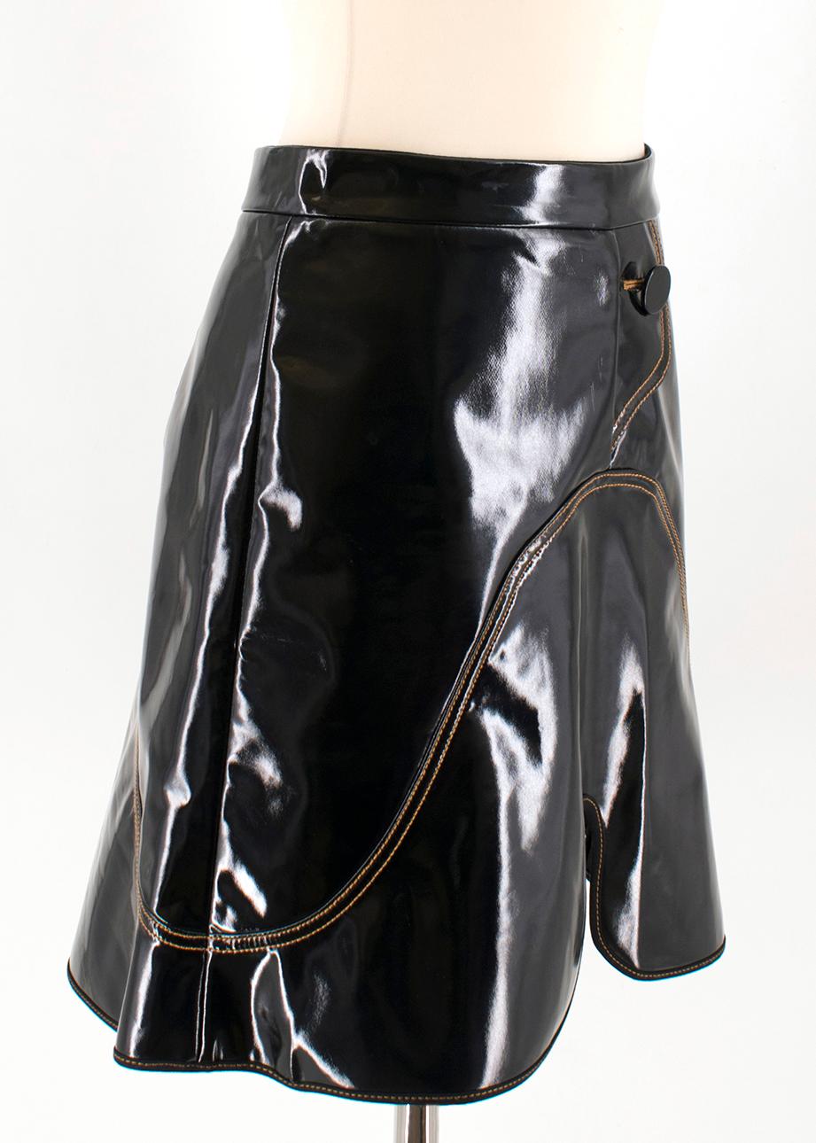 Ellery Milky Way Black Mini Skirt

- Black mini skirt
- Lightweight
- High shine coated fabric
- Contrast stitching detailing
- Centre-back concealed button and zip fastening
- Asymmetrical hem

Please note, these items are pre-owned and may show