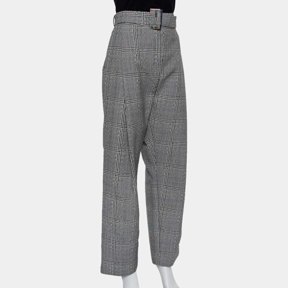 Presenting fine tailoring signs, a relaxed silhouette, and clean cuts, these monochrome trousers by Ellery are highly comfortable and offer a great wearing experience. The pair features a belted waistline and four pockets.

Includes: Brand tag, Belt