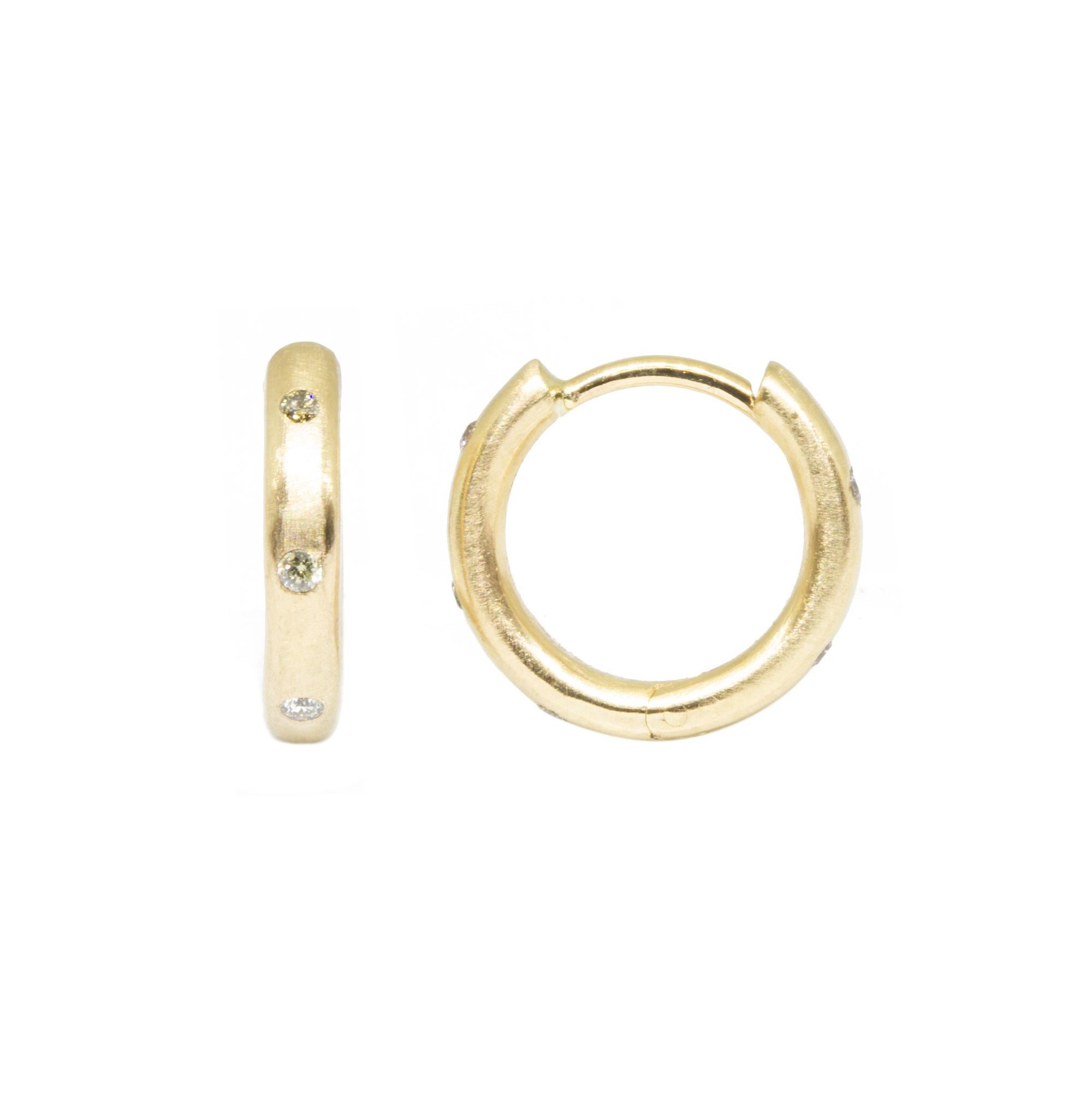 Detailed with sparkling diamonds, the Gold Hoops are made for dangling your favorite Charms (or a few). Or wear them on their own for an effortless, understated look.


Details
Metal: 14K Gold, 18K Gold
Diamond carat: 0.2
Size: 13mm
Diamond size: