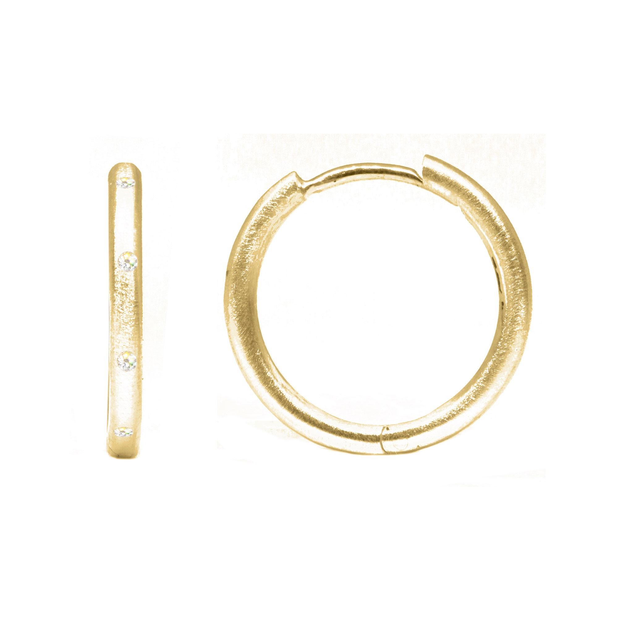 Pair the Ellie 18mm 18K Gold Hoops feature responsibly-sourced diamond accents. Paired with your choice of gemstone charms, they complement any ensemble while showcasing subtle elegance.

Details
Metal: 18K Rose Gold
Diamond carat: 0.25
Hoops Size: