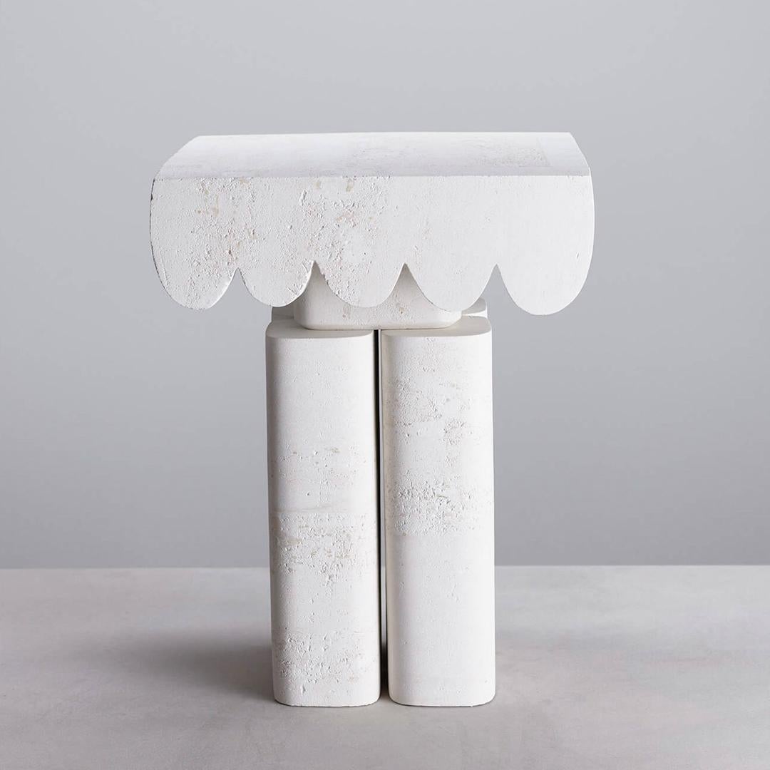The Classic range Ellie side table designed by Steve John Clark is made of South Australian Limestone and sculpted entirely by hand.