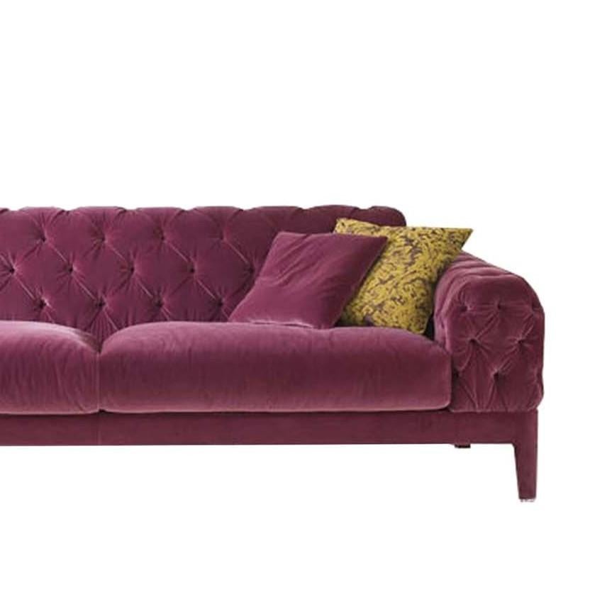 This exclusive sofa captures the elegant lines of classic sofas with an exceptional tailored finish that will infuse glamour both in traditional and modern living rooms. Entirely upholstered with a soft velvet fabric in dark fuchsia (col. 1470/17