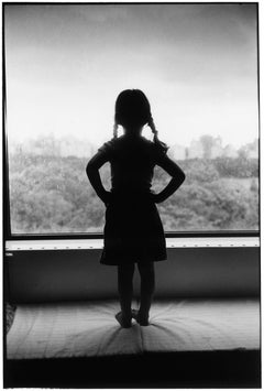Vintage Little girl looking out window, New York City 