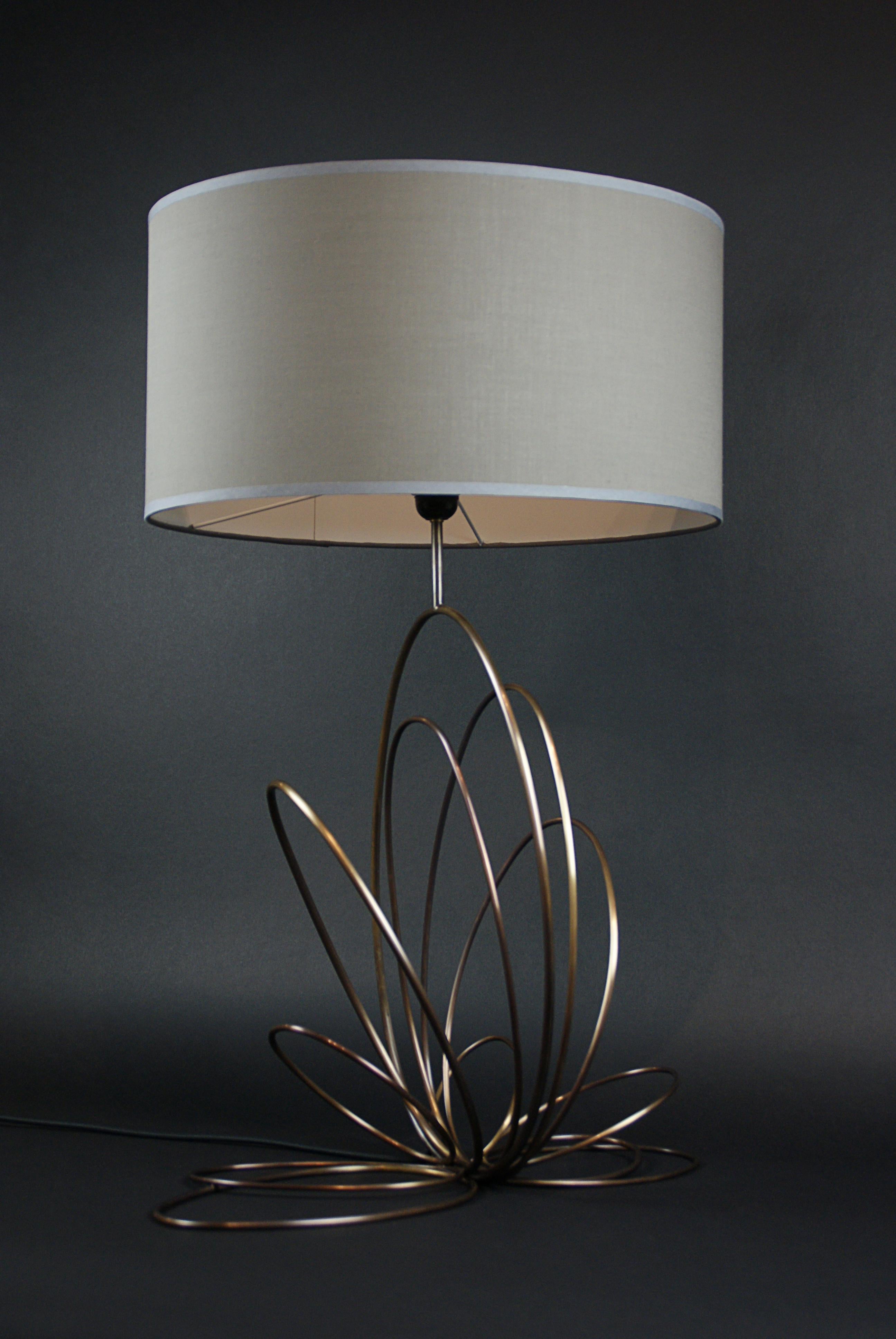 Ellipse 3 Table Lamp by Atelier Demichelis
Dimensions: W 53 x D 40 x H 80 cm
Materials: patinated brass, grey fabric shade

Laura Demichelis

Laura was born & brought up in Provence, in the south of France.
Trained at the École Boulle in Paris, she