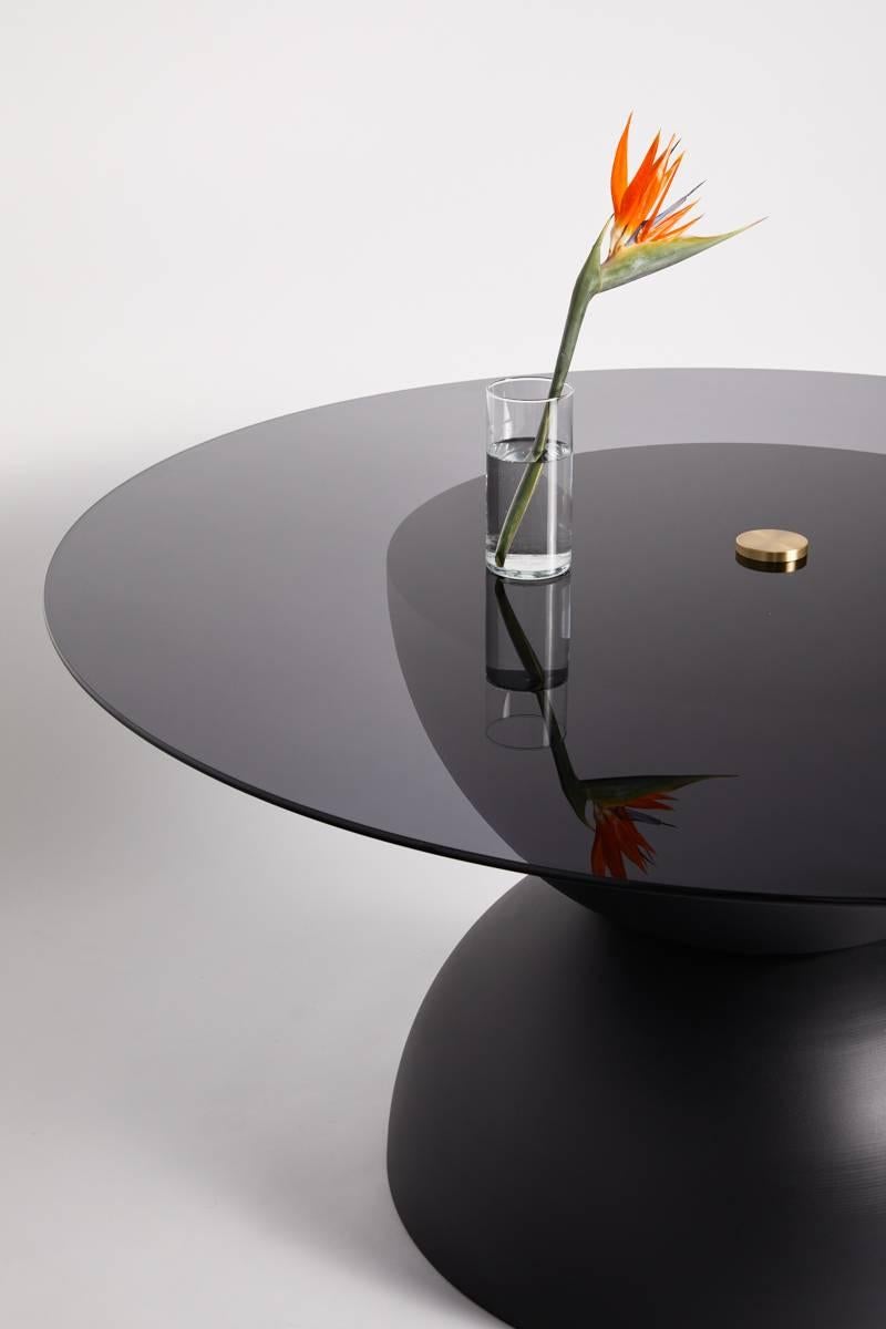 Two large 32” hemisphere’s meet to create a vast surface. Supporting a circular top in either
10mm glass or your choice of 3/8” sheet metal in brass, aluminium or copper. Base is offered in a
variety of finishing options from our powder coating,
