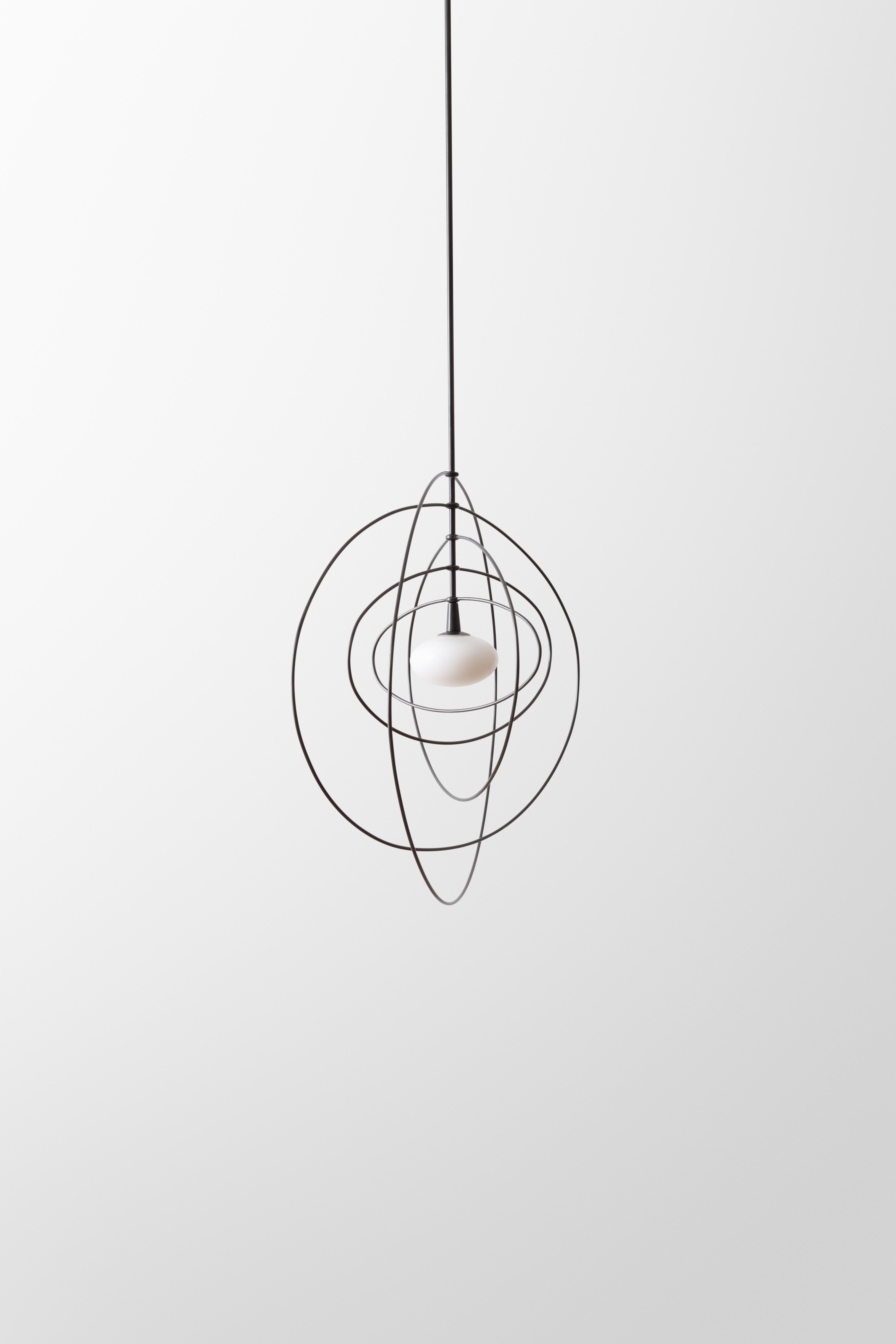 North American Ellipse Mobile Pendant LED Kinetic Sculpture with Blown Glass and Brass Rings For Sale
