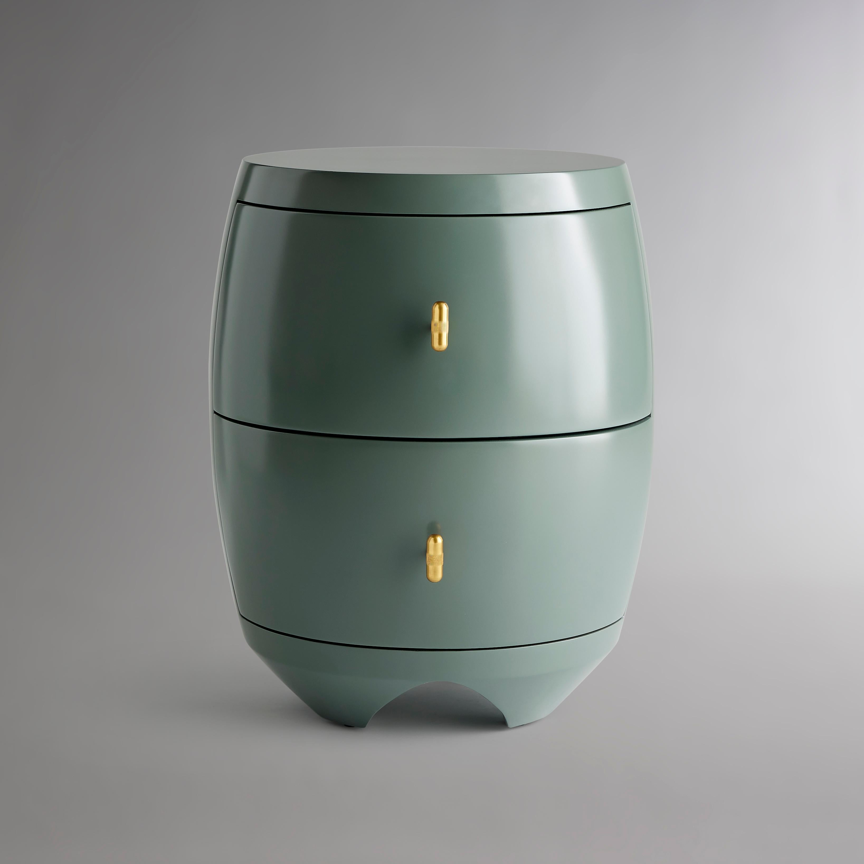 Arc-shaped drawers glide from this inventive side table, pulled by pill-shaped burnished brass hardware with etched midlines. A flat top gives way to a barrel silhouette that tapers at the bottom into feet with elegant arches between each. All cased