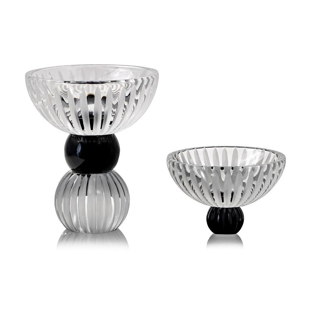 Pieces Included:  Made in Italy Spoon, Footed Bow, Lid Bowl

     The Ellipses footed crystal bowl is a handcrafted, multifunctional centerpiece that blends style and functionality. Its innovative design and look, made of black and clear crystal,