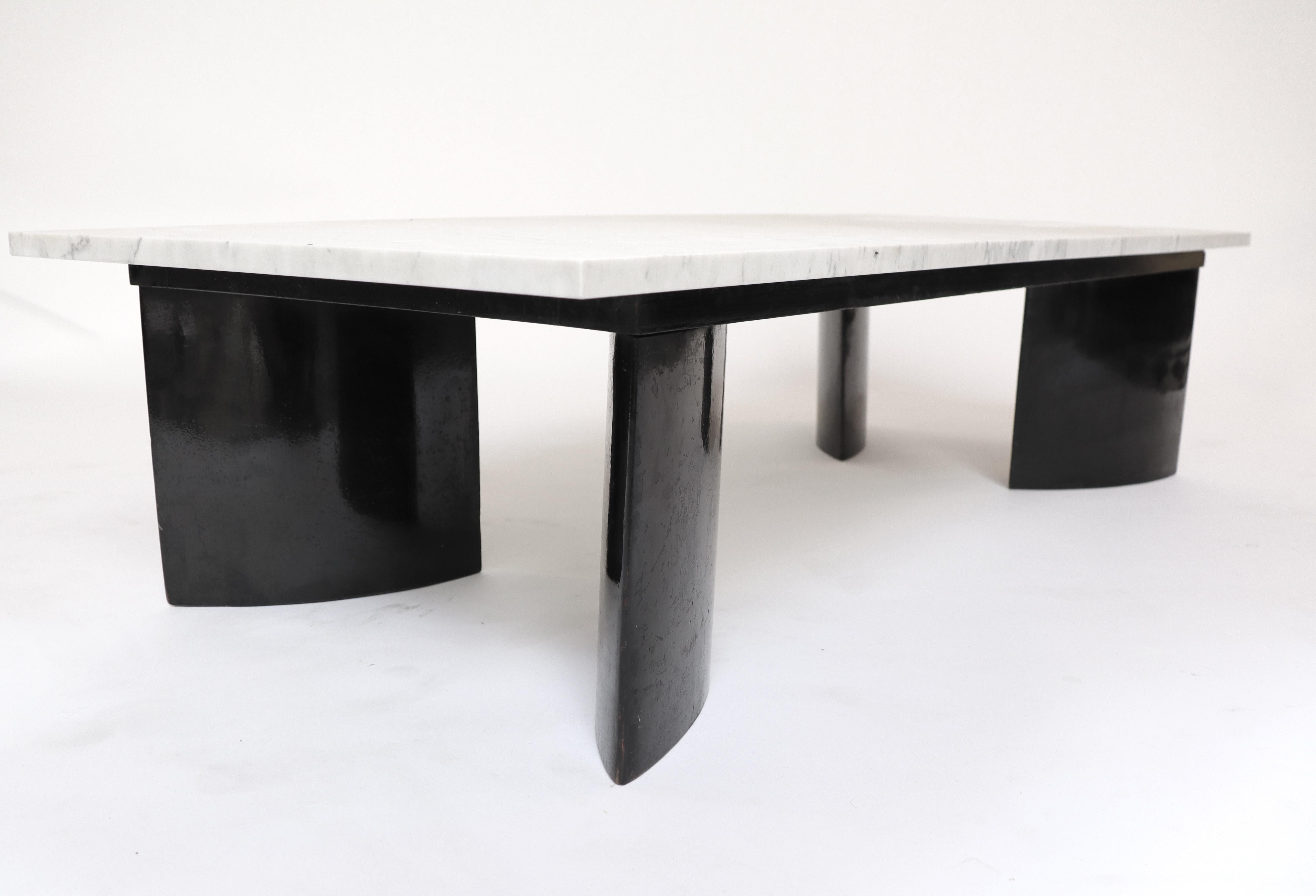 Elliptic  feet Coffee Table by Joaquim Tenreiro.

Original black Lacquered wood structure with Carrare Marble top (Finish: softened).
The Modernist gesture of Tenreiro from the European architecture influence with the elliptic form is associated to
