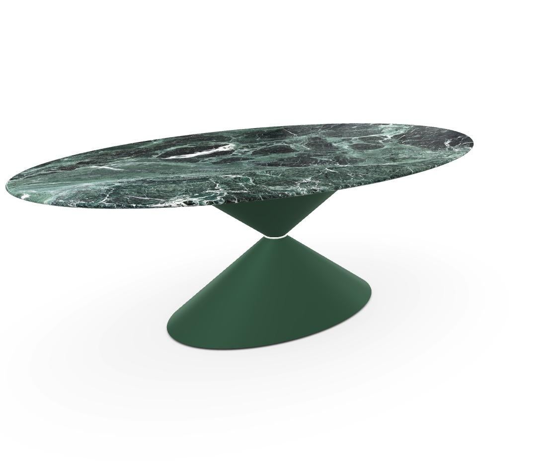 The Clessidra dining table by Midj brings an elegant and modern touch to any dining space. Designed by Paolo Vernier, this table showcases a striking hourglass-shaped base with a central ring detail, creating a sculptural and glamorous focal point.