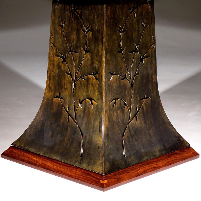 Exotic Bolivian Rosewood top with Patinated Steel base. Bamboo filigree motif on base.
One of a kind piece signed by artist.