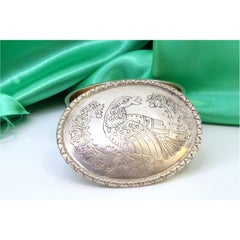 Elliptical silver box with bird-engraved lid and friezes