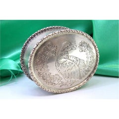 Elliptical silver box with bird-engraved lid and friezes