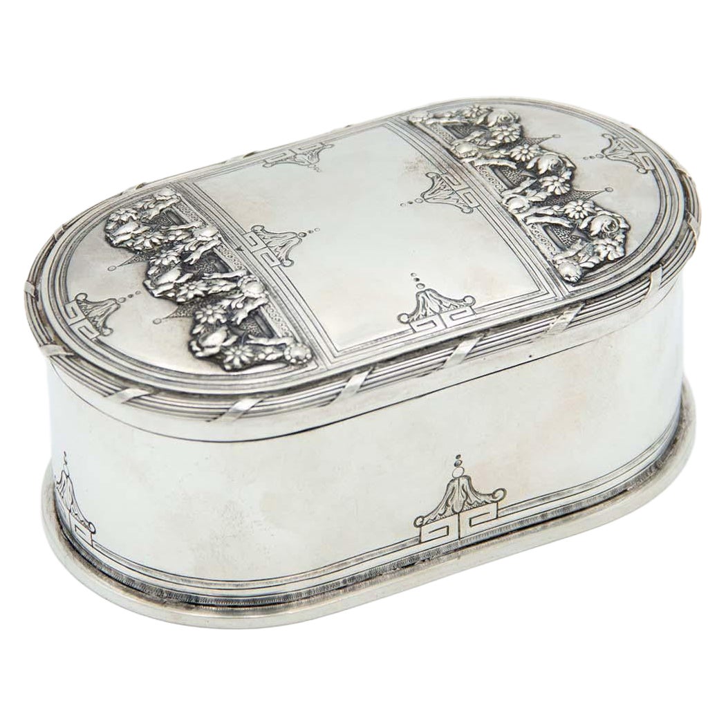 Elliptical silver soap dish with floral reliefs