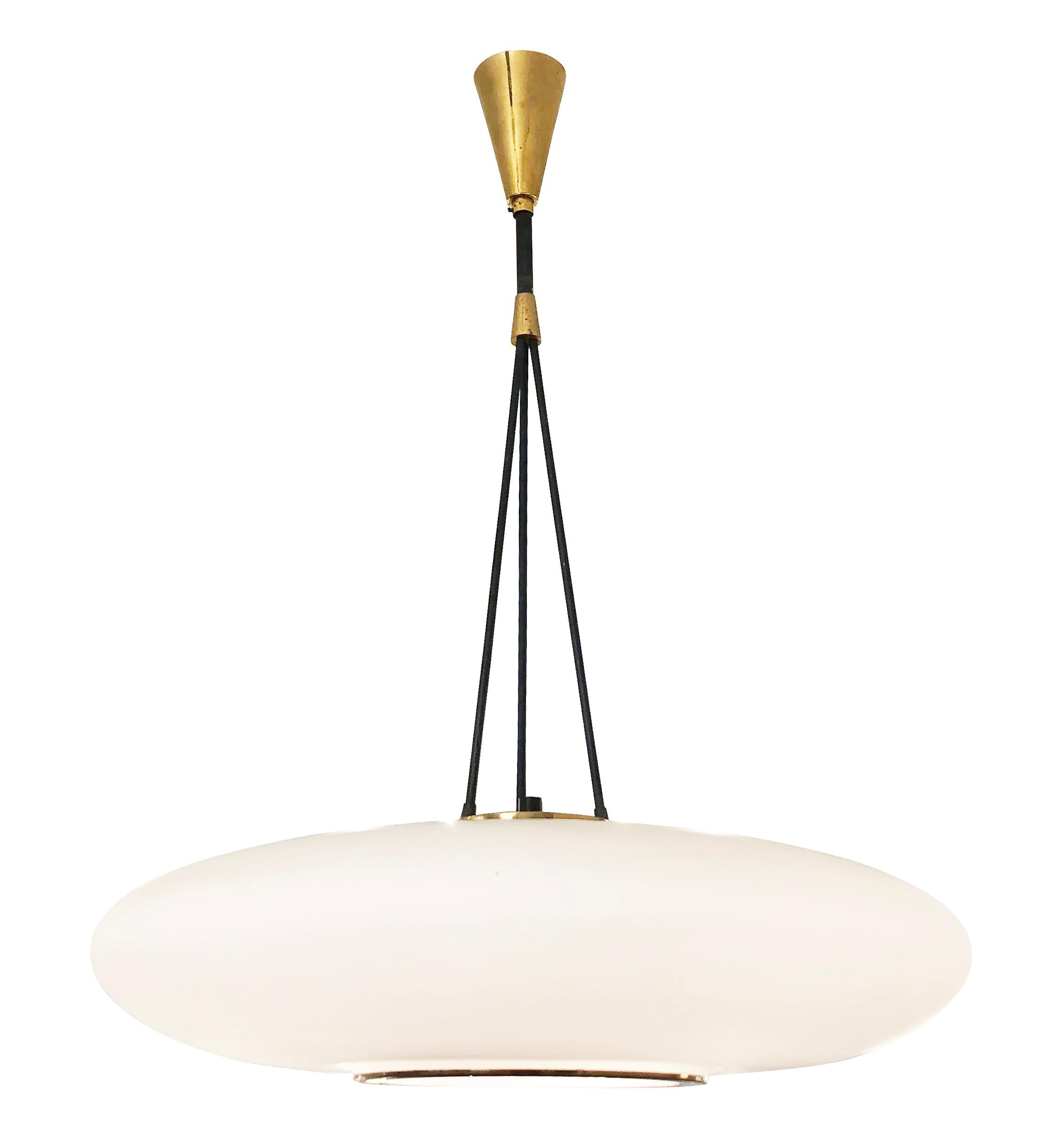 1960s Stilnovo Style pendant with an elliptical frosted glass shade. The opening on the bottom has a brass rim and the three stems on top coverage in a large main stem. Holds three candelabra sockets.

Condition: Excellent vintage condition, minor