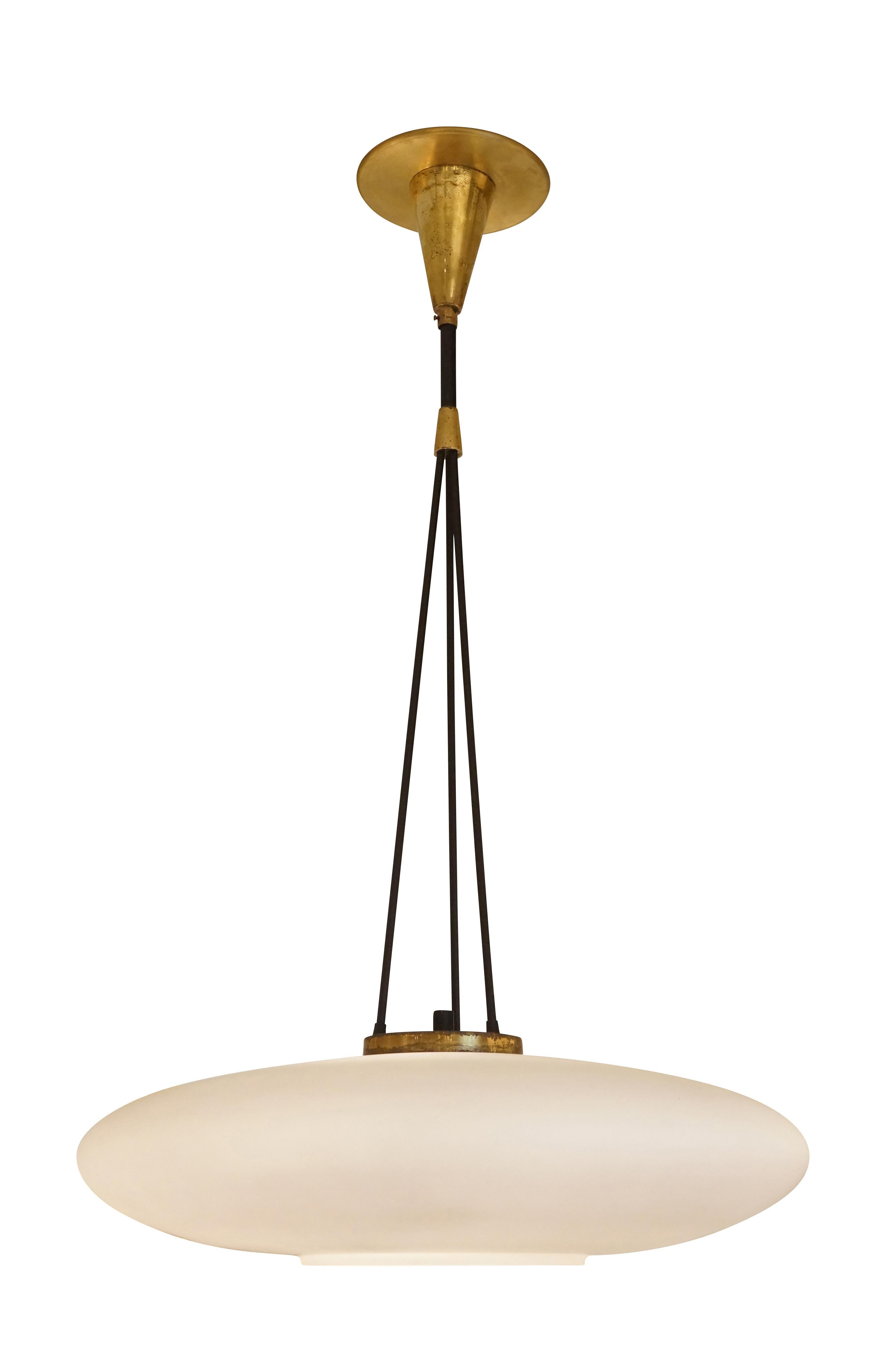 1960s Stilnovo pendant with an elliptical frosted glass shade. The three stems on top converge in a large main stem. Holds three candelabra sockets. 

Condition: Excellent vintage condition, minor wear consistent with age and use.

Diameter: 18”