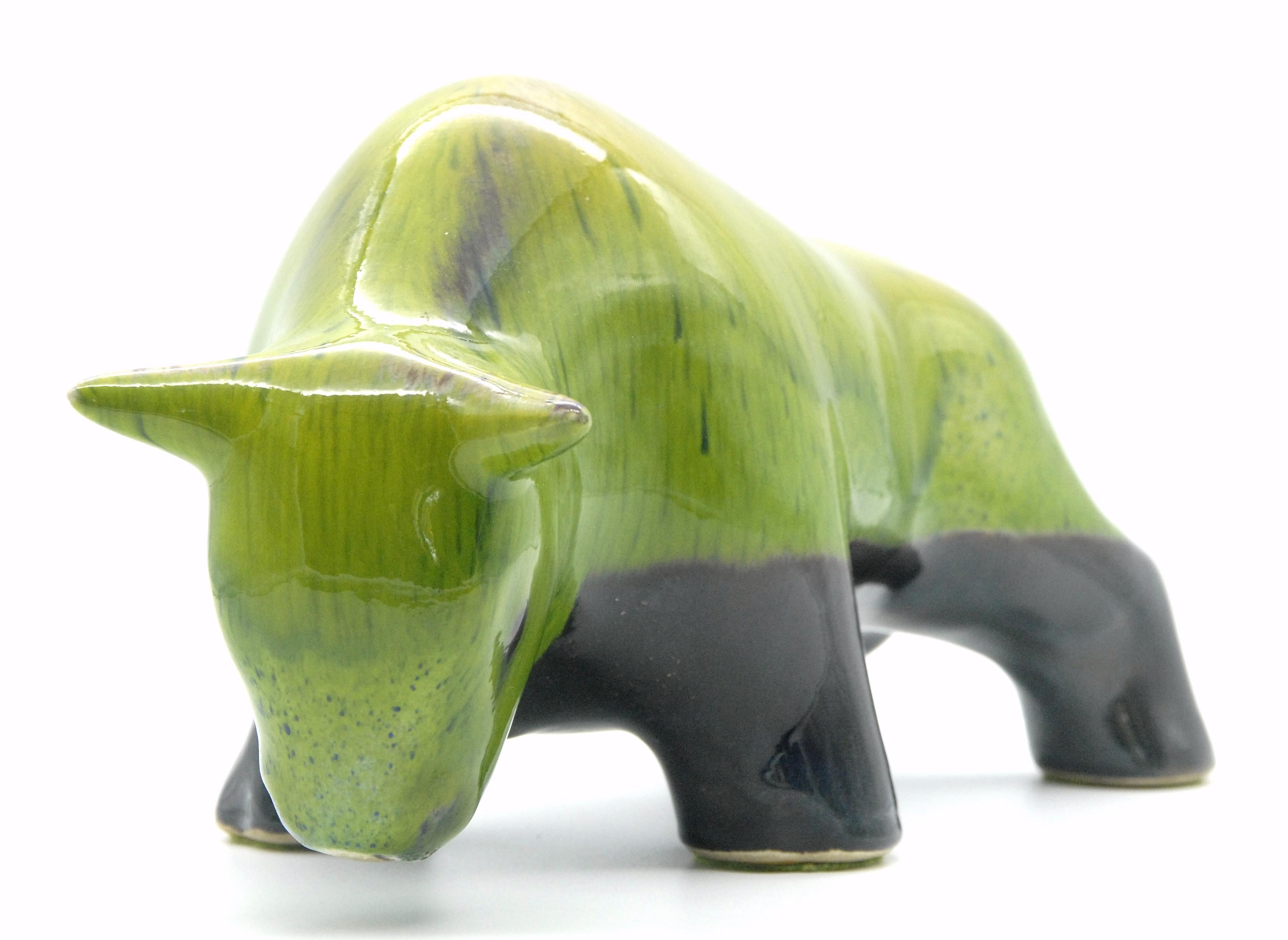 A rare green glazed bull from the Melbourne factory of Ellis in Melbourne in the 1950s. The piece has its original paper label [usually missing].