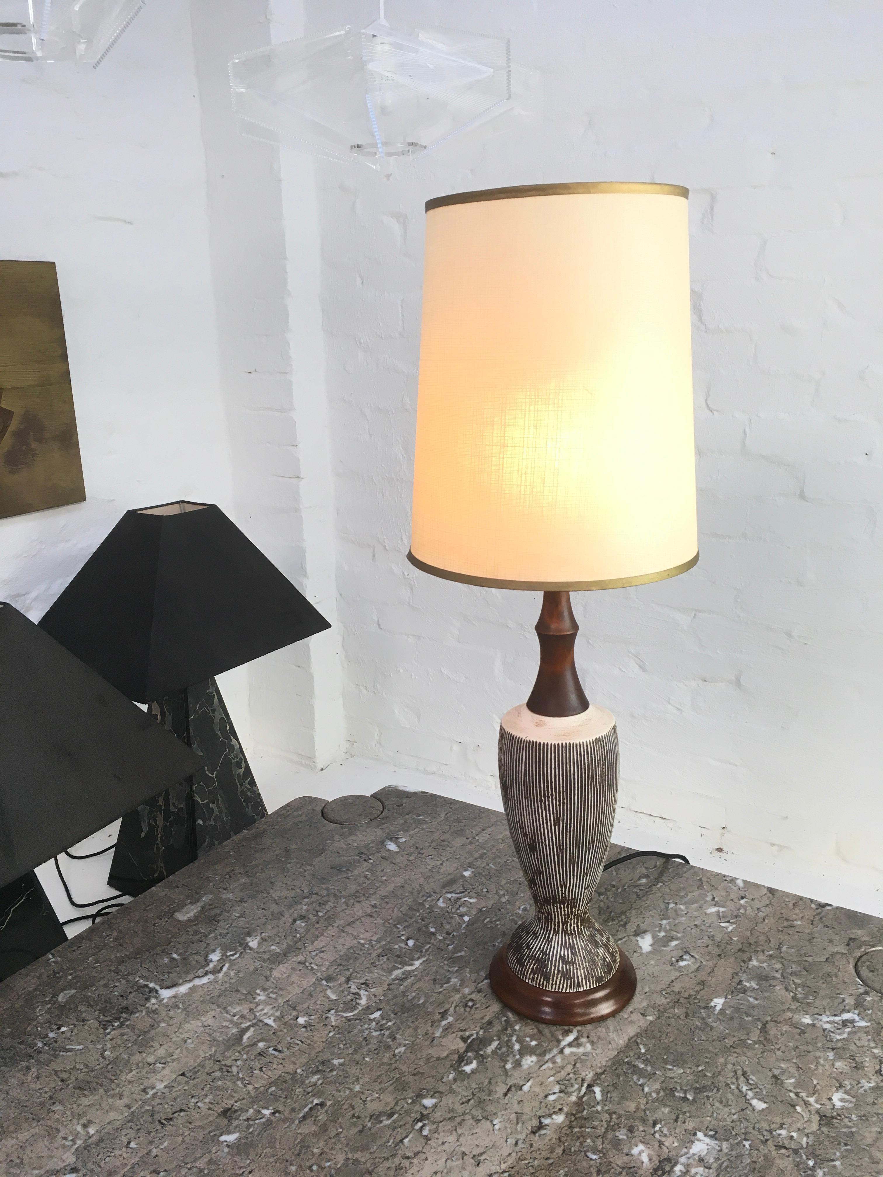 An Ellis Pottery ceramic lamp with Australian blackwood base and a turned myrtle stem stained to a deep walnut finish.

We love these ceramic and timber Ellis lamps for their Classic pared-down midcentury aesthetic. This one is in excellent