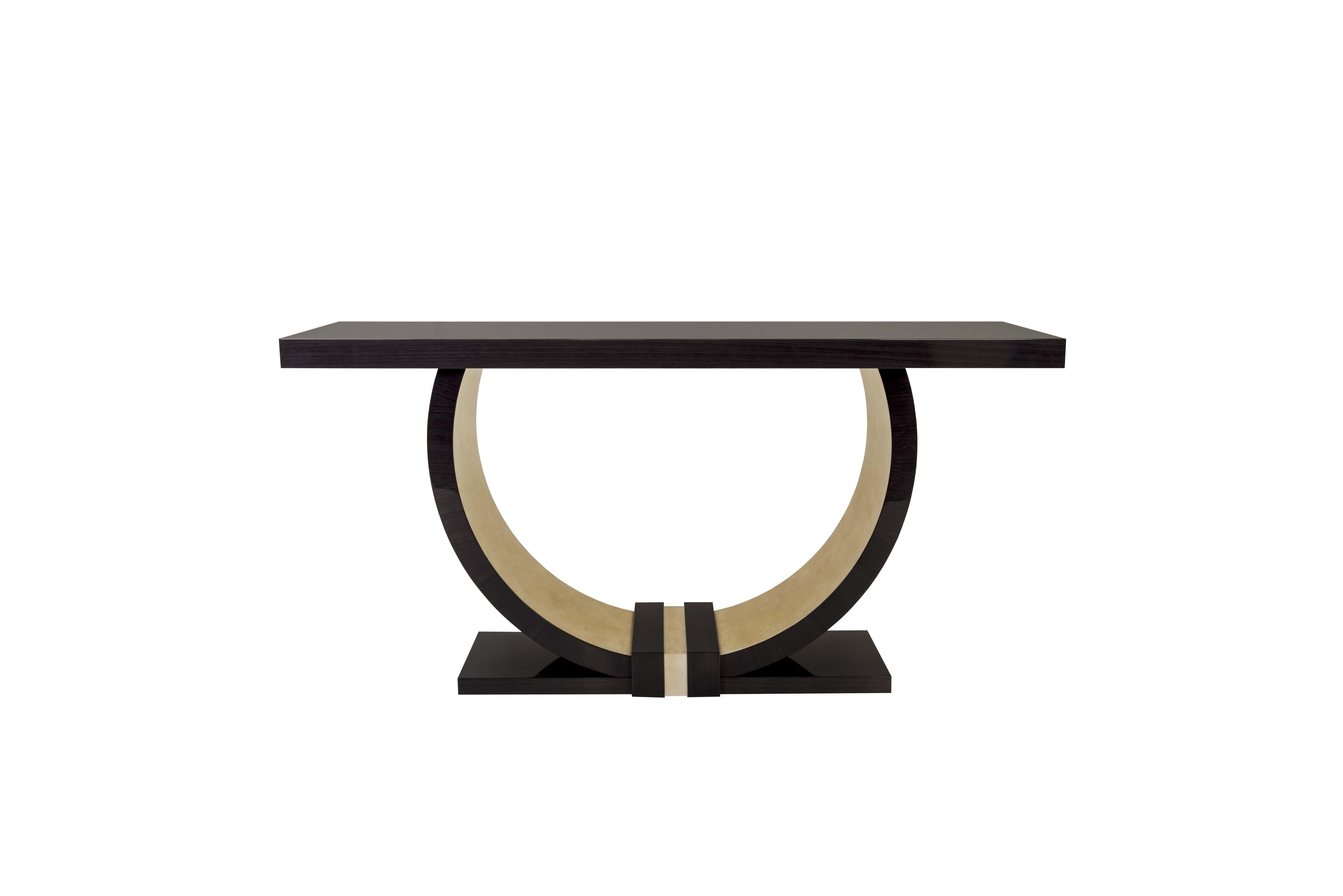 The Ellis Sculptural Console Table is a statement of refined sophistication, featuring a bold semi-circular base in dark wood with a luxurious gold leaf interior accent. Its striking U-shaped design merges artistic form with functional purpose,