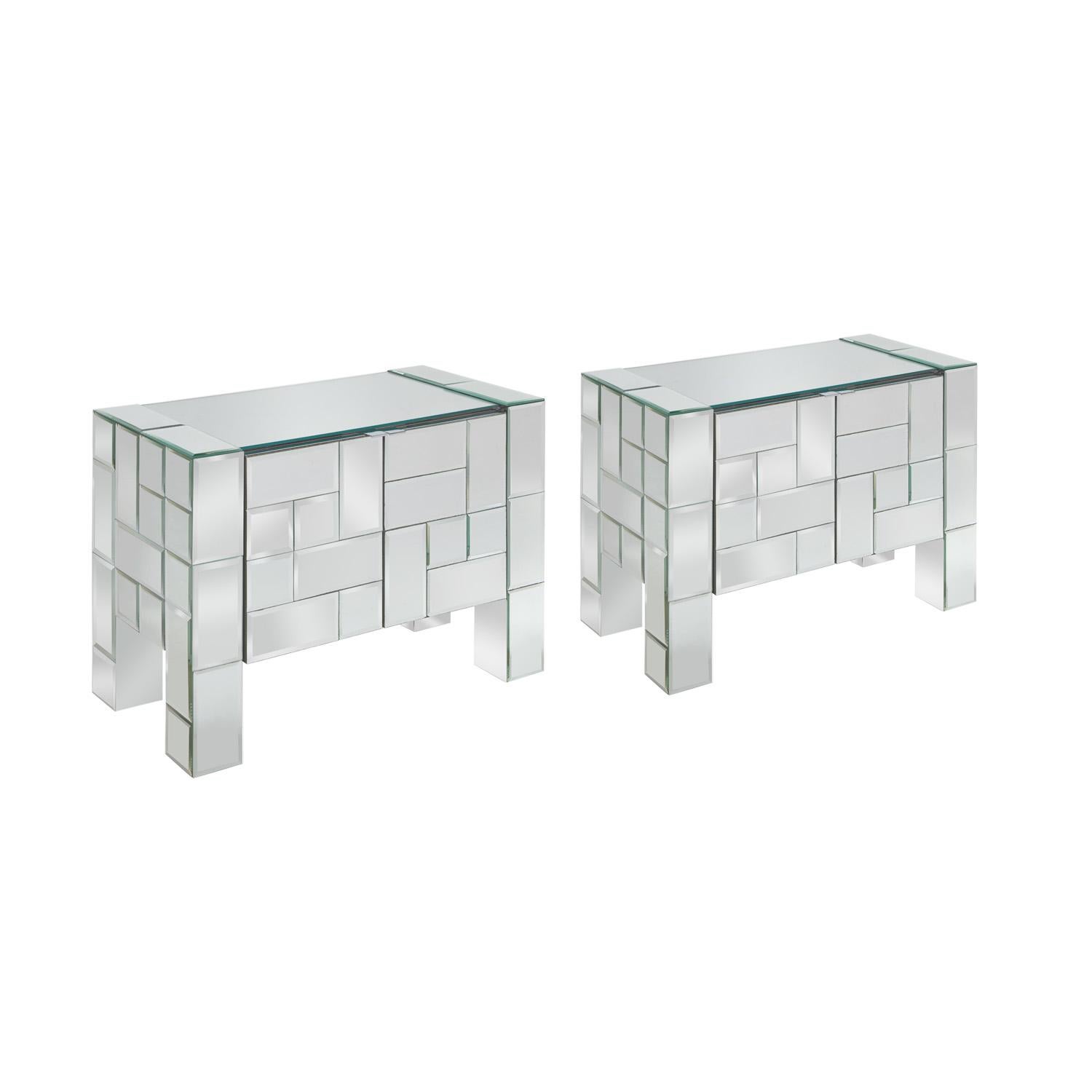 Pair of beautifully made 2 door bedside tables in tessellated beveled mirrors with chrome accents attributed to Ello, American 1970's. This is a unique model - much more complex than their typical models. They are quite glamorous.