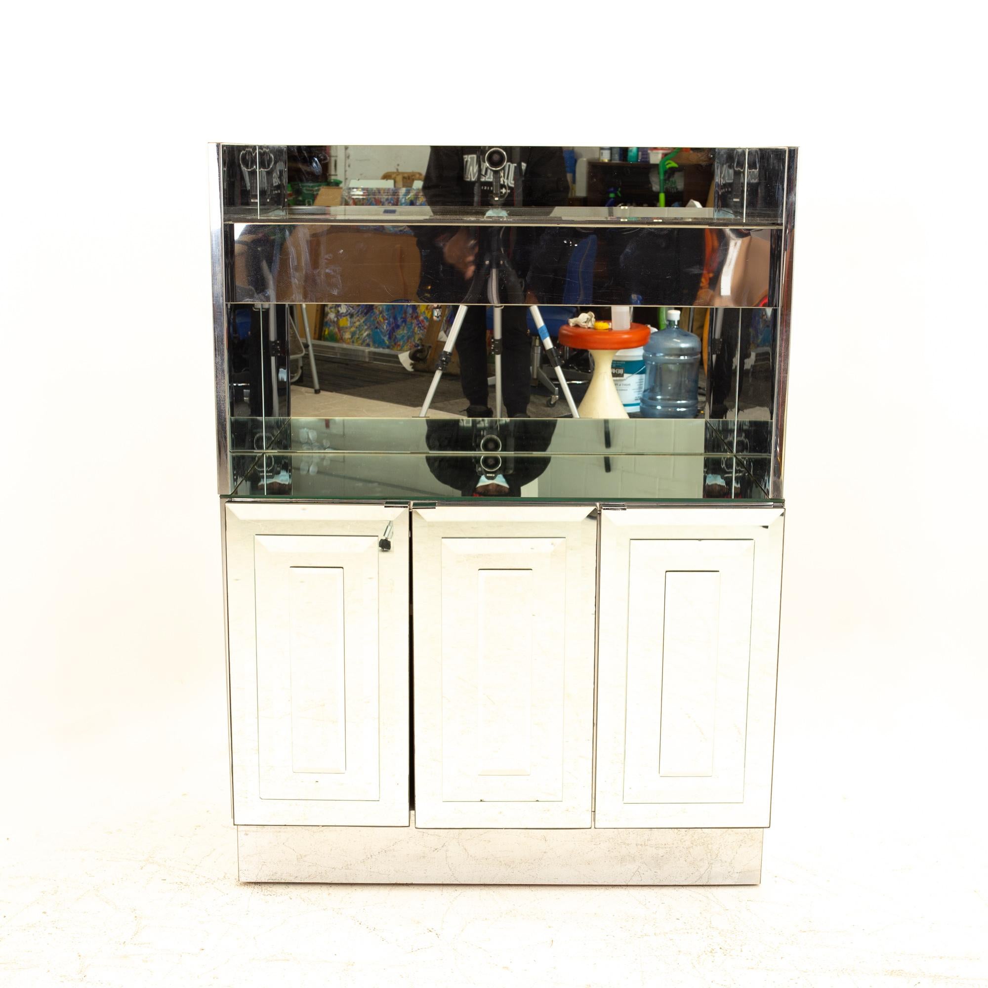 Ello Skycraper Mid Century mirrored bar cabinet
Cabinet measures: 36 wide x 17 deep x 28 high

All pieces of furniture can be had in what we call restored vintage condition. That means the piece is restored upon purchase so it’s free of watermarks,