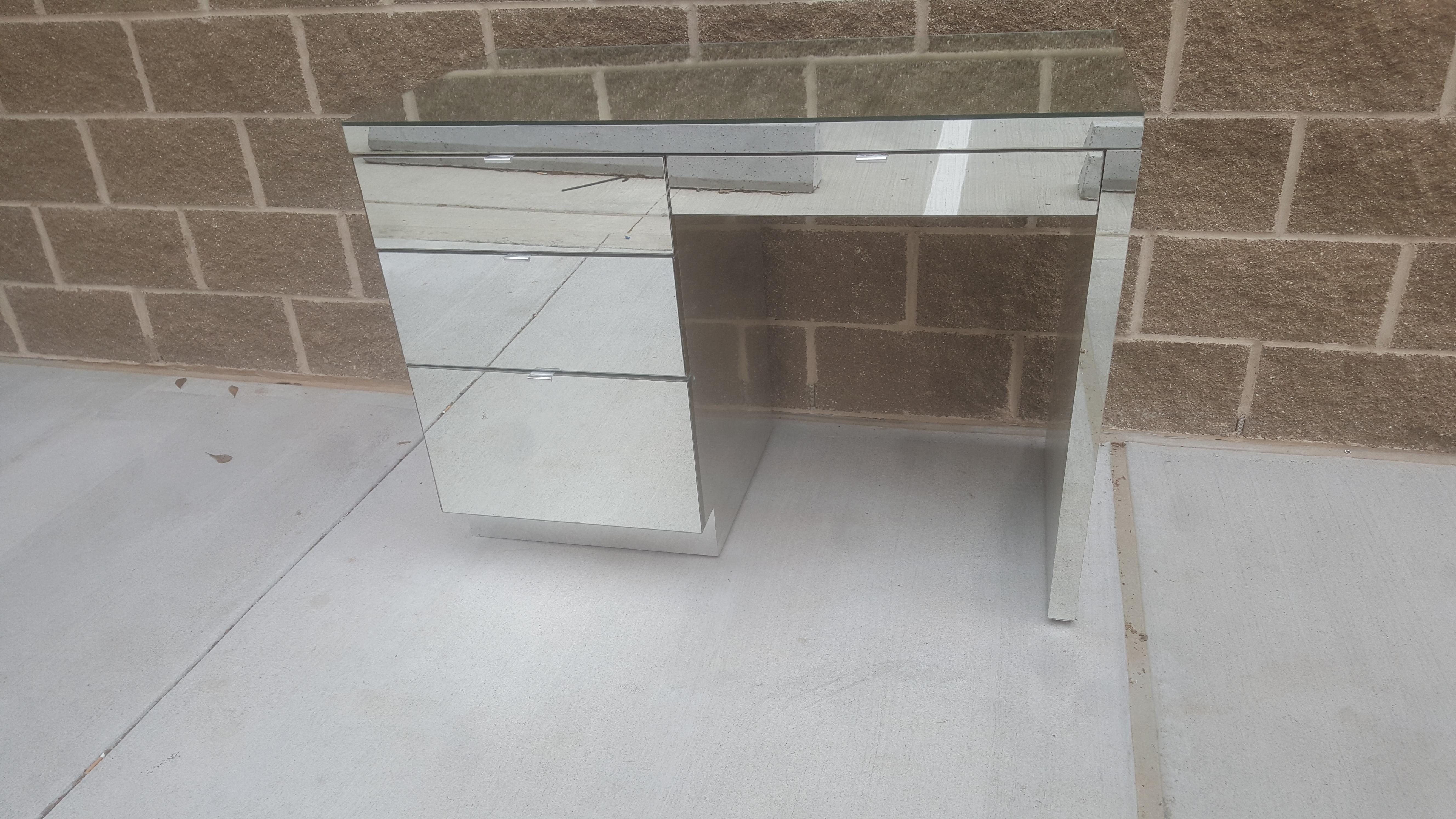 Incredible ello mirror desk with 3 draws on left side and one pencil draw above kneehole area. Chrome pulls with chrome body. Perfect for a small groovy office.