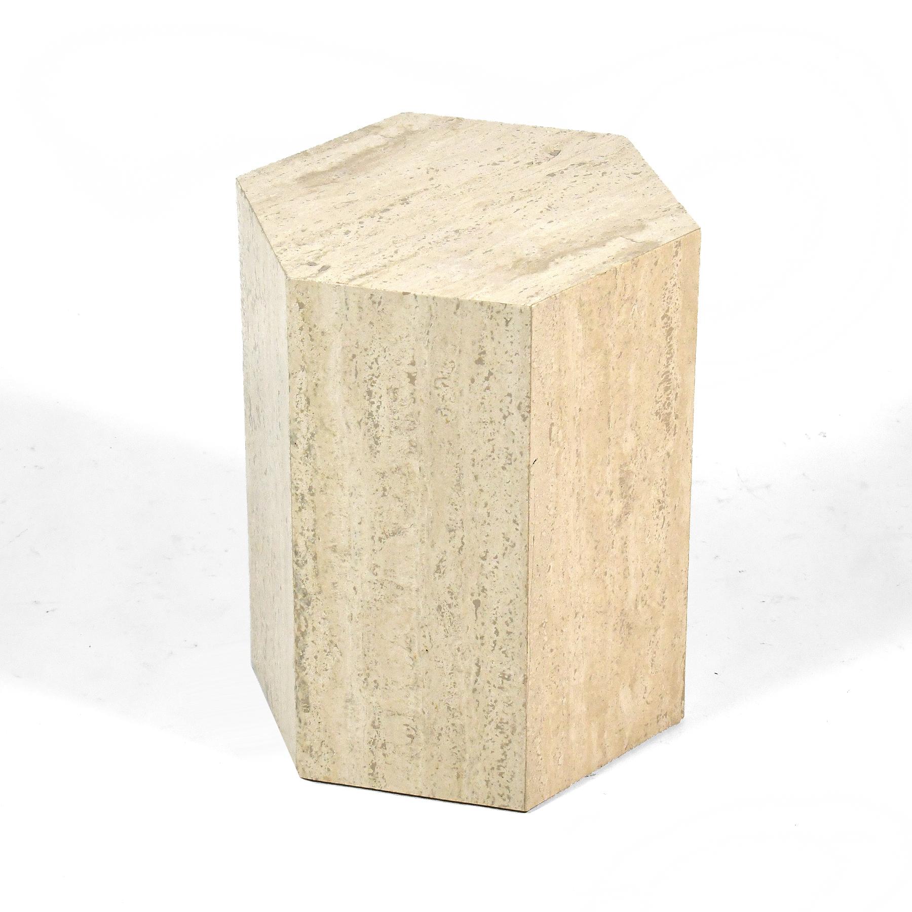 A tasteful little piece that can serve equally well as a side table, a nightstand, or a pedestal, the hexagonal form is fabricated of travertine marble.

18 1/8