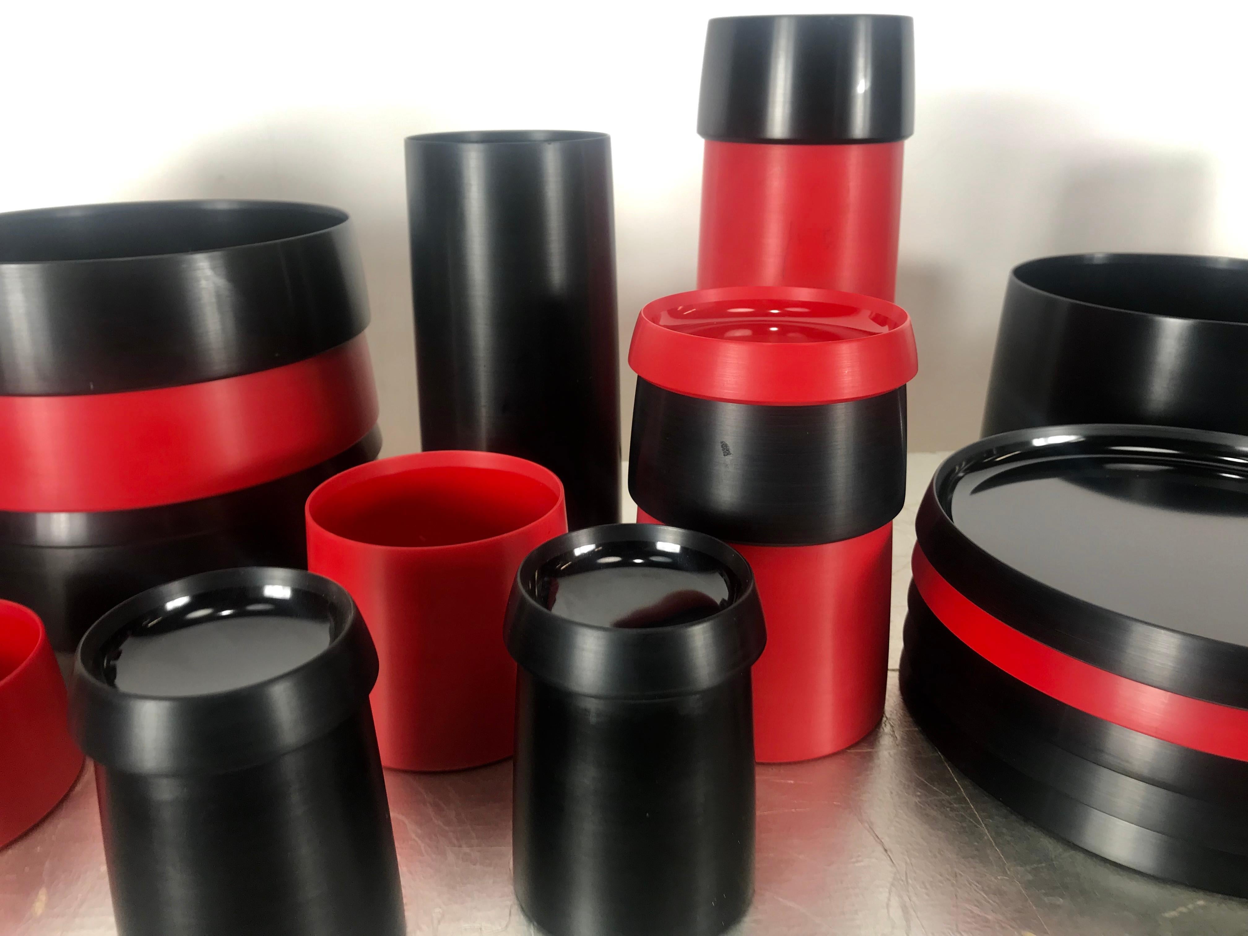 Ellusive Plastik, Skale 34 piece tableware, Torben Orskov, 1953 Denmark. No longer in production,. Stunning set, red and black bakelite, consisting of bowls, cups, plates, containers, lids etc. Ingenious stackable design, Form elegant table setting,