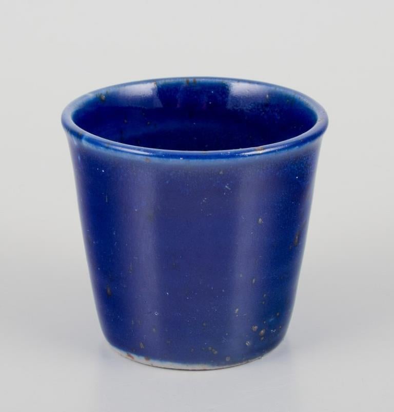 Elly Kuch (1929-2008) and Wilhelm Kuch (1925-2022).
Kuch Keramik, Germany.
Three unique miniature vases.
Glaze in royal blue, green, and abstract motif.
1980s.
In perfect condition, one vase with natural crazing and two minor chips at the bottom.