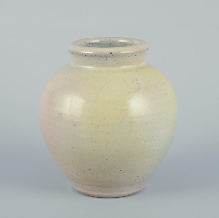 Elly Kuch (1929-2008) and Wilhelm Kuch (1925-2022). 
Two unique ceramic vases. 
One vase in matte glaze with brownish tones.
The other vase with glaze in yellow and pink tones.
From the 1980s.
One vase signed 