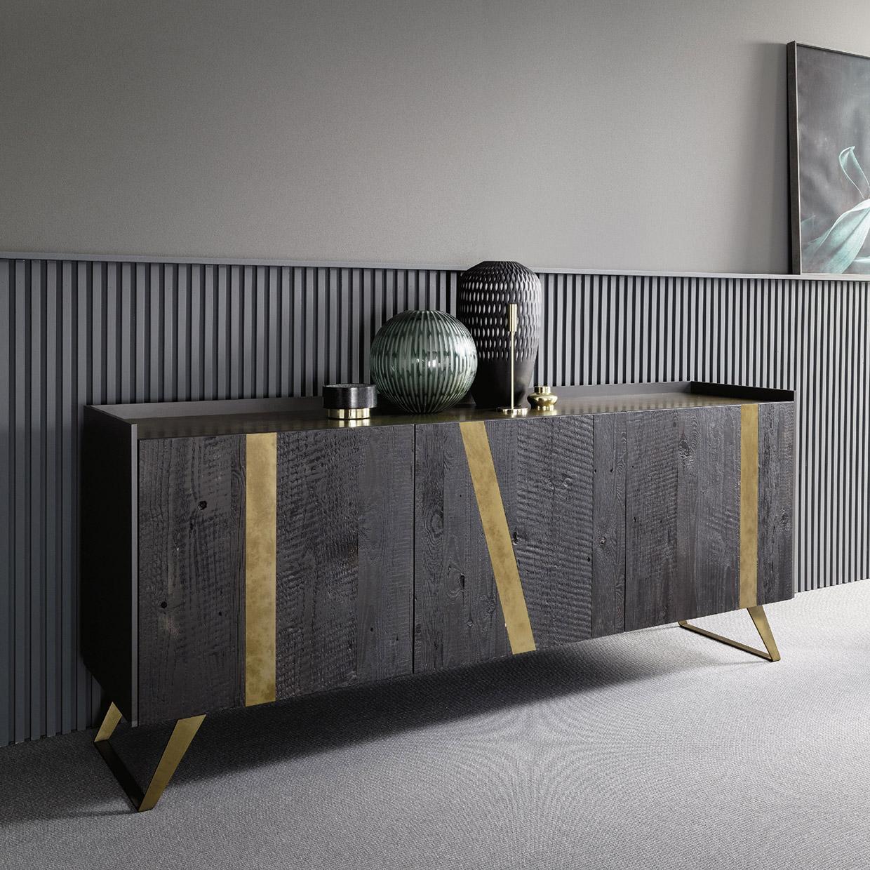 Elly is a contemporary sideboard that merges an essential design with bold Italian craftsmanship. Distinctive bronzed metal feet deliver sleek linear modernism to a graphite lacquered body. The charcoal-stained oak doors feature precious inlays in