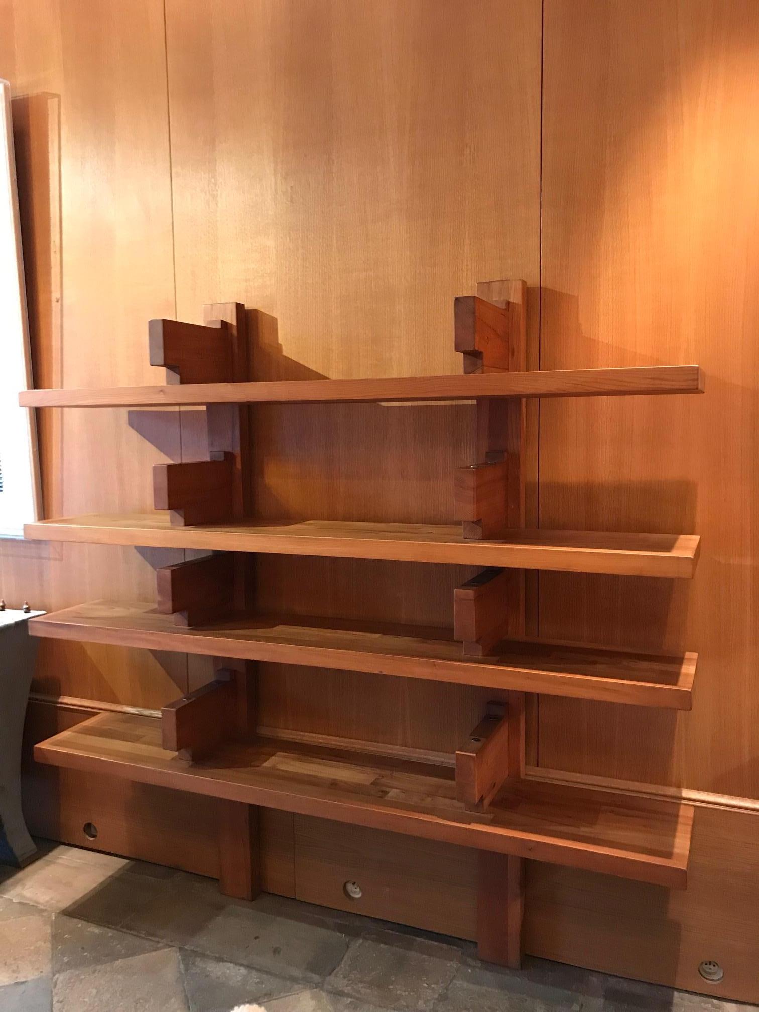 Wall-mounted elm bookshelves by Pierre Chapo, model B17a.