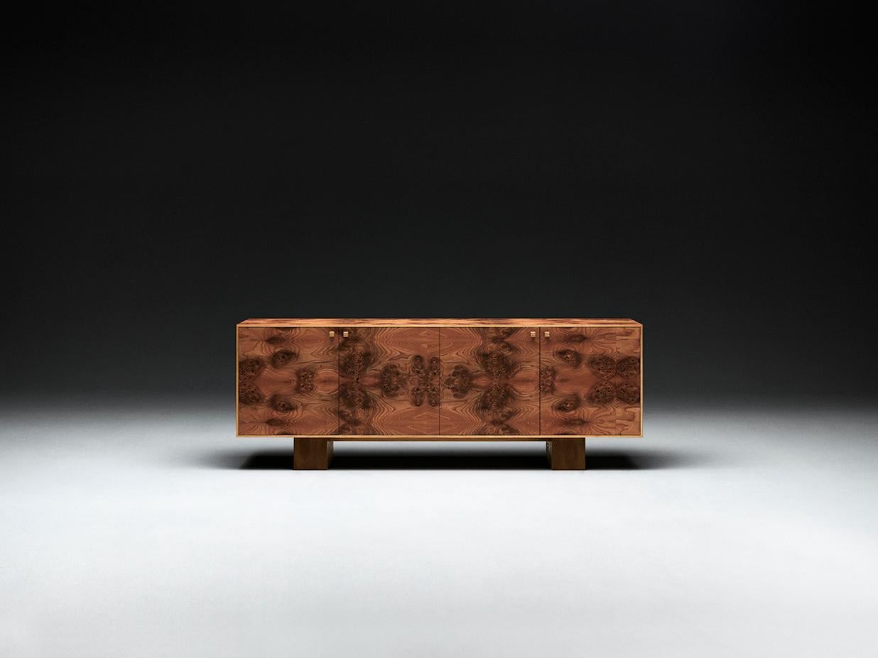 The Elm Burl Sideboard merges inspiration from historic furniture design with brutalist references. Made out of elm burl, the piece combines the warmth of the wood with a minimalist, contemporary design. 

