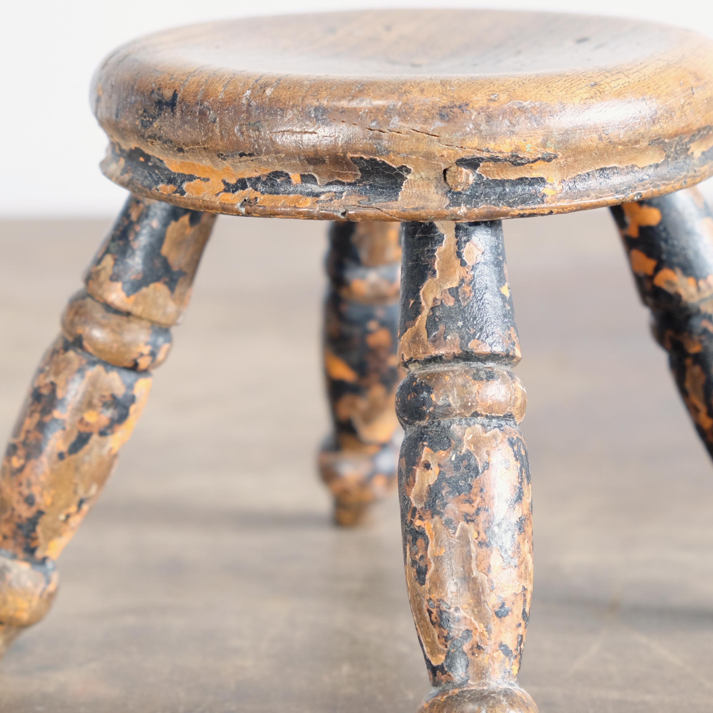 Charming little antique stool or candle stand with a turned elm top on four turned legs. Layers of well worn old paint give it a lovely character, 19th century.
Perfect for pillar candles or just as a decorative item in its own right.

  