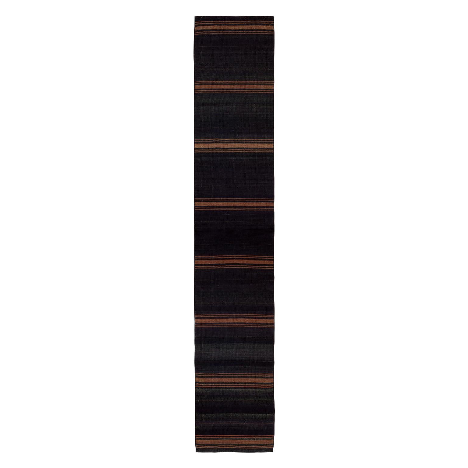 Elm Cazbah Runner Kilim 92 Rug by ETHNİCLOOM
Dimensions:  W 700 x H 100 cm
Materials: Wool Weave. 

The Founder
Ethnicloom was founded as a natural continuation of its creator, Elif Gönensay’s lifelong passion for design and her talent for