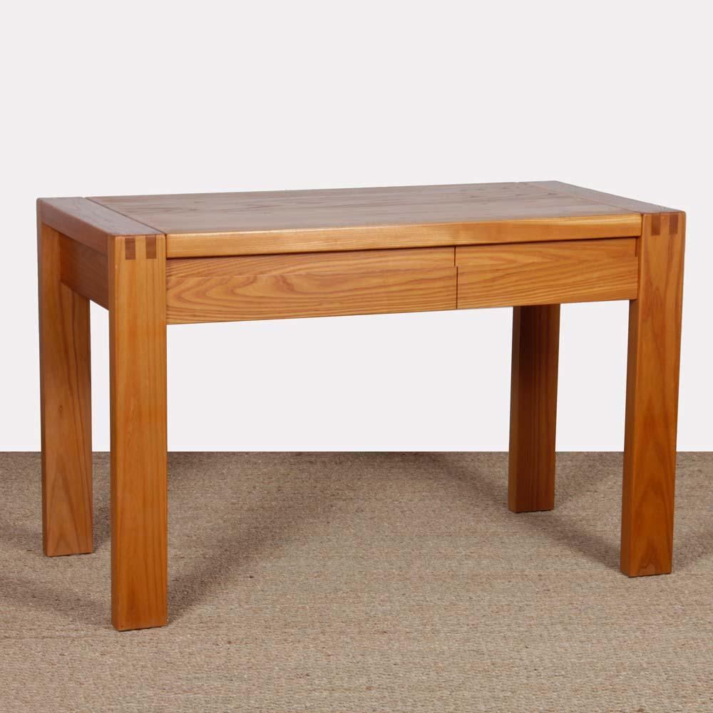 This solid elm desk was produced in France by Maison Regain around 1980. It includes two drawers. This piece of vintage furniture is in good original condition. 