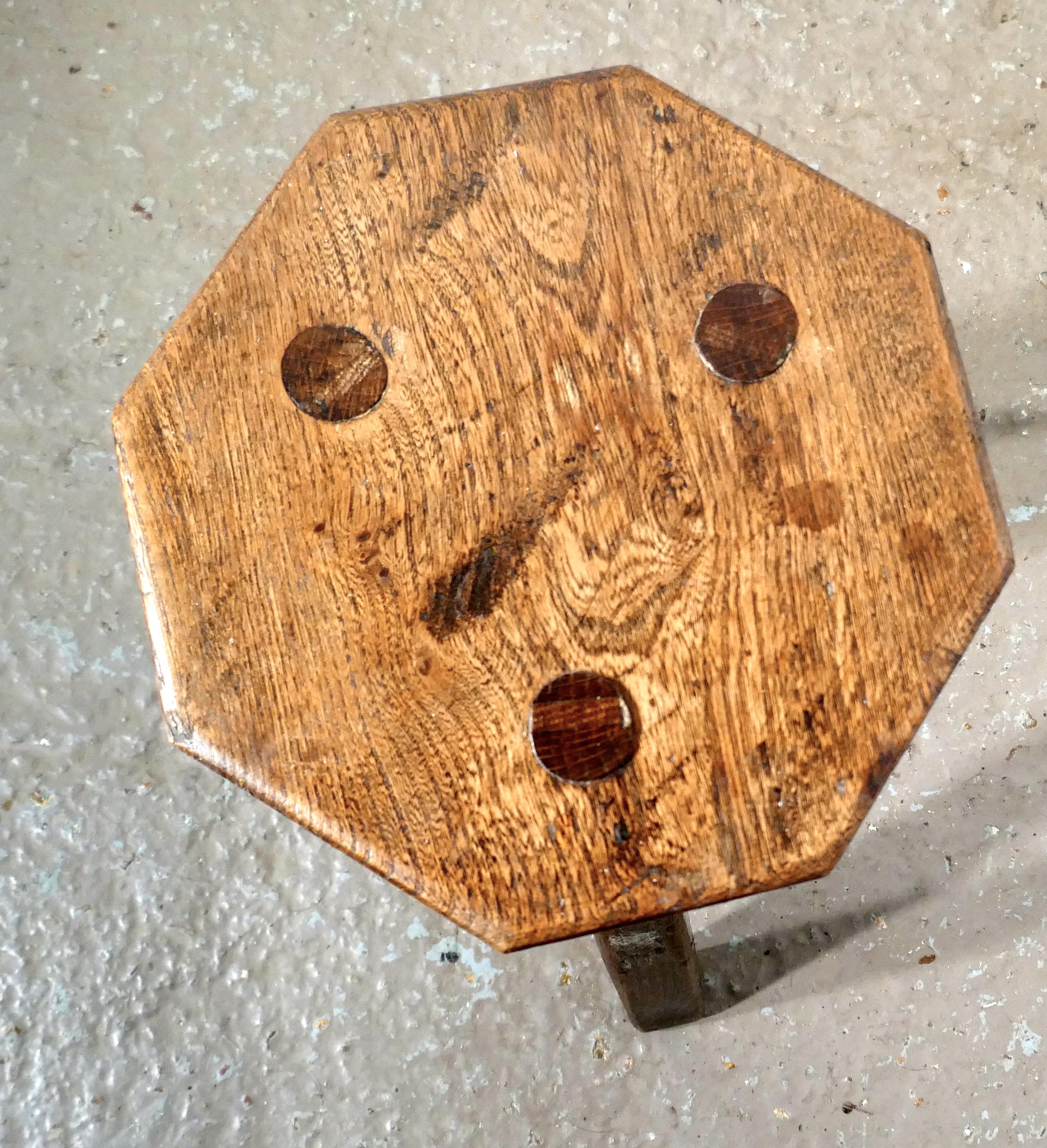 Elm milking stool or dairy stool

The stool is made in elm, the seat has 8 sides and it is 1.5” thick it is a very sturdy piece standing on 3 oak legs
The stool is in very sound condition with an aged patina it is 14.5” tall, the seat is 10”x 8”