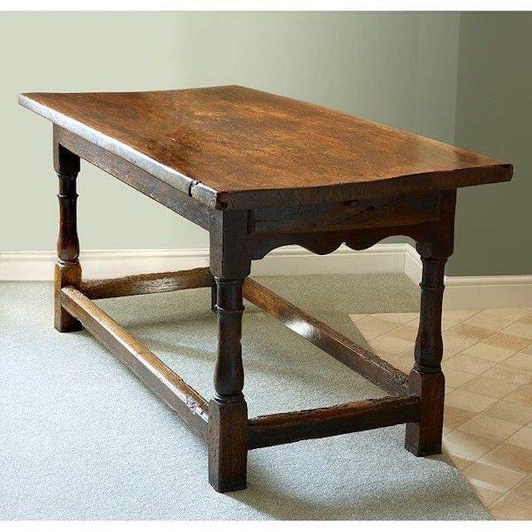 Late 17th-early 18th century Elm refectory table, with a small draw at one end. 

Measurements:
Length 5 ft 1