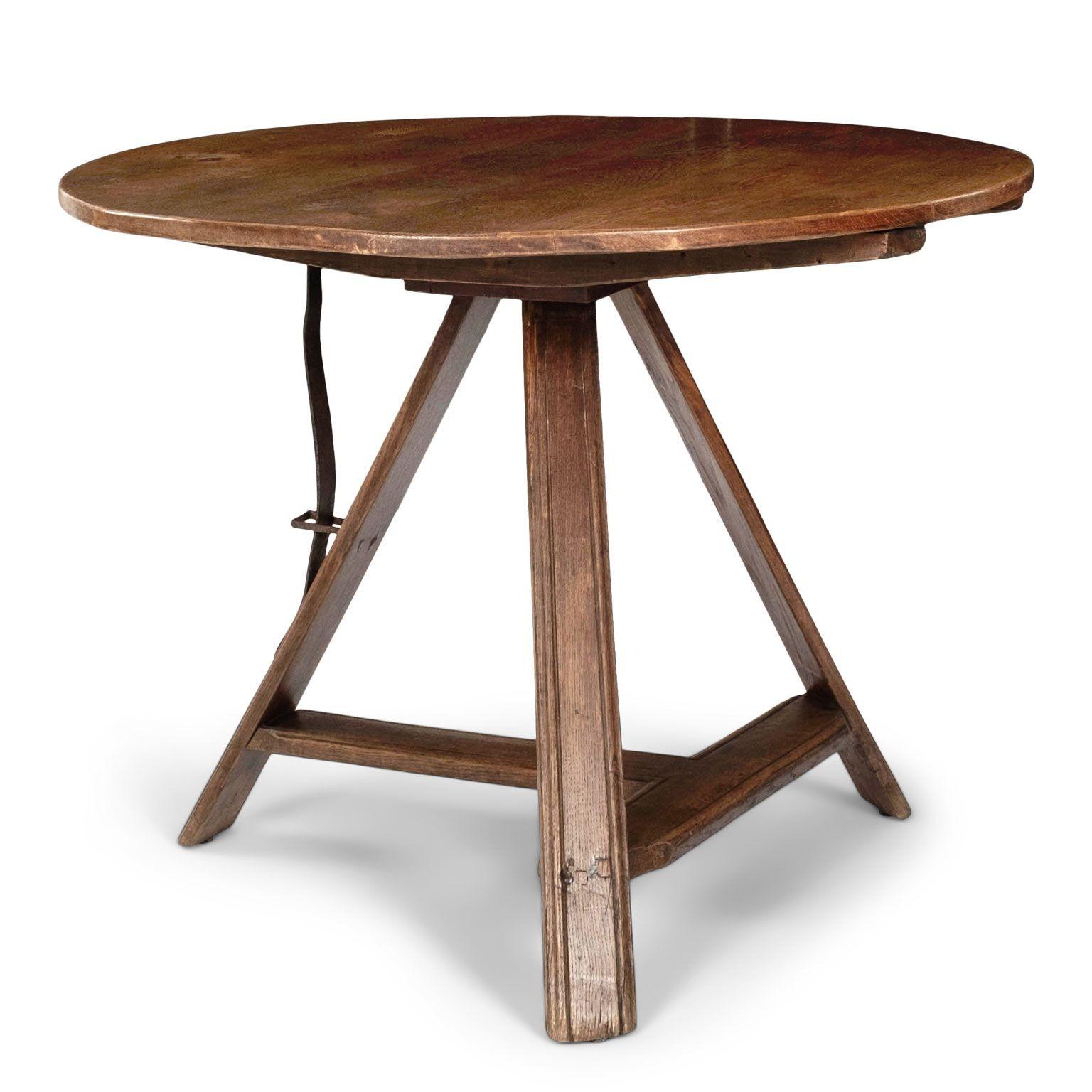 Elm round Dutch tilt top table upon tripod base.
