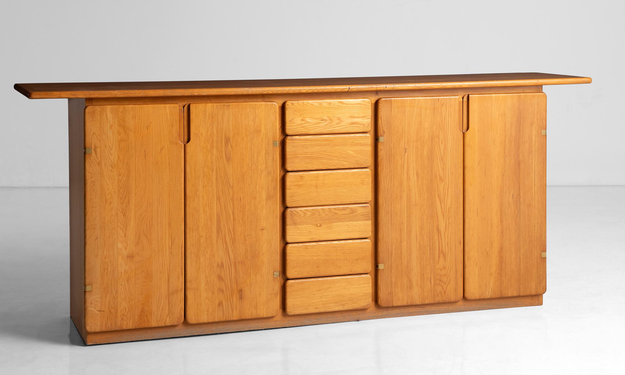 Elm sideboard.

France, circa 1960.

Simple modern storage unit with natural patina.

Measures: 86.75”L x 17.75”D x 35.5”H.