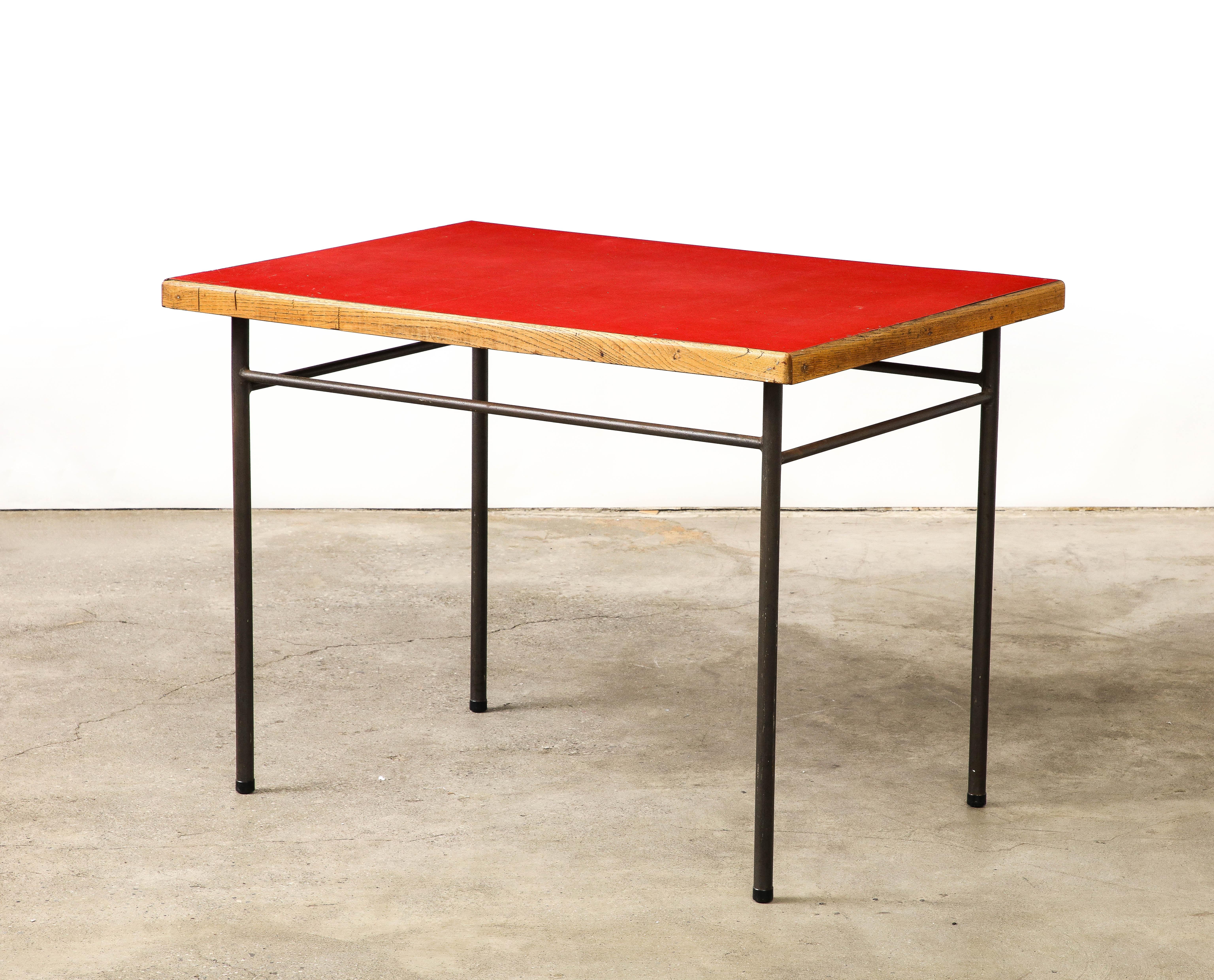 This modernist desk/table was designed by Marcel Gascoin for the Cité Universitaire Jean Zay d'Antony in 1955; the dorm rooms and public spaces encapsulate post-war French design and were collaborated on by designers such as Jean Prouvé, Charlotte