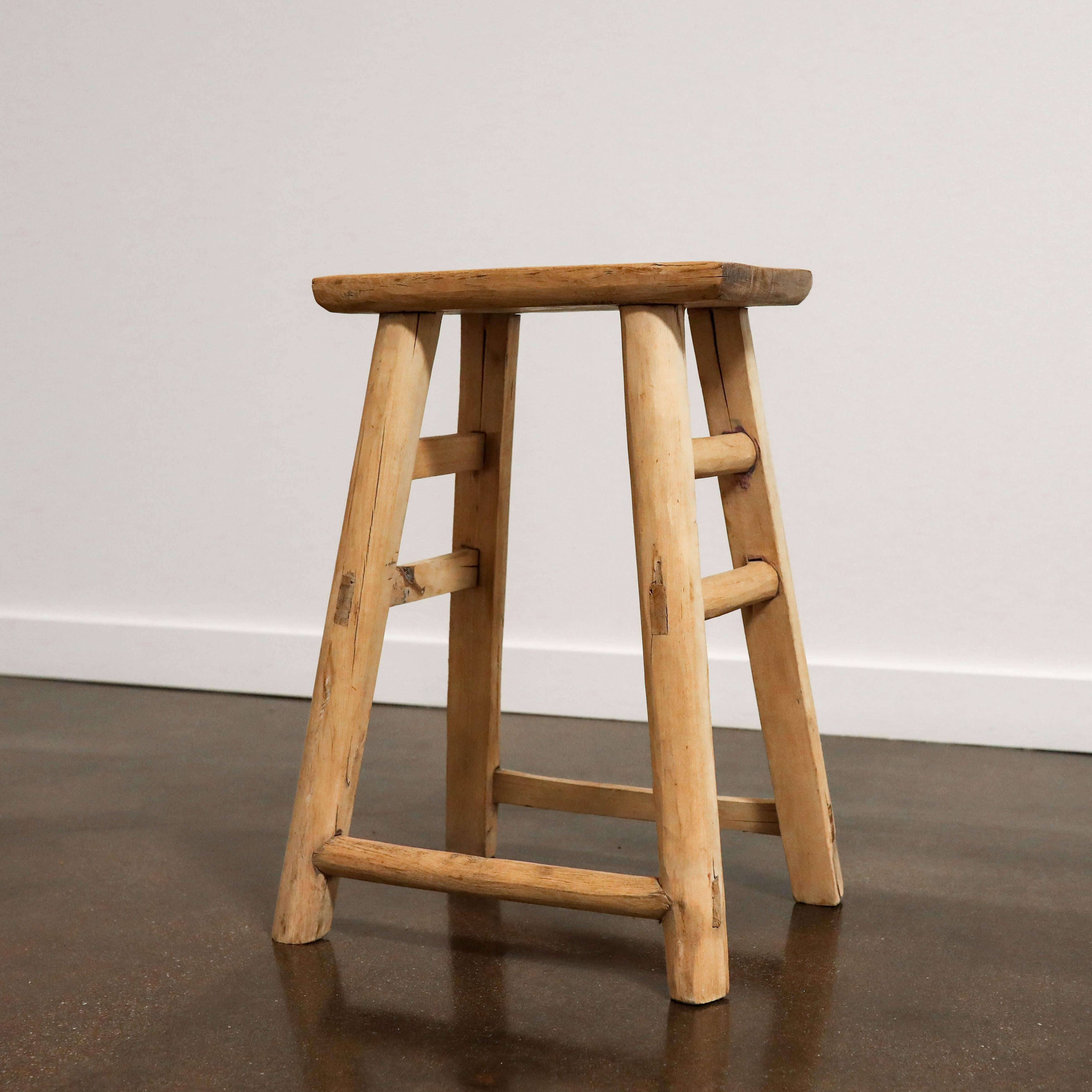 Handmade elm stool imported from Taiwan. These characteristics are inherent to the material and part of the intended aesthetic. Each piece is unique, so please inquire if you have a preference for a specific variation.