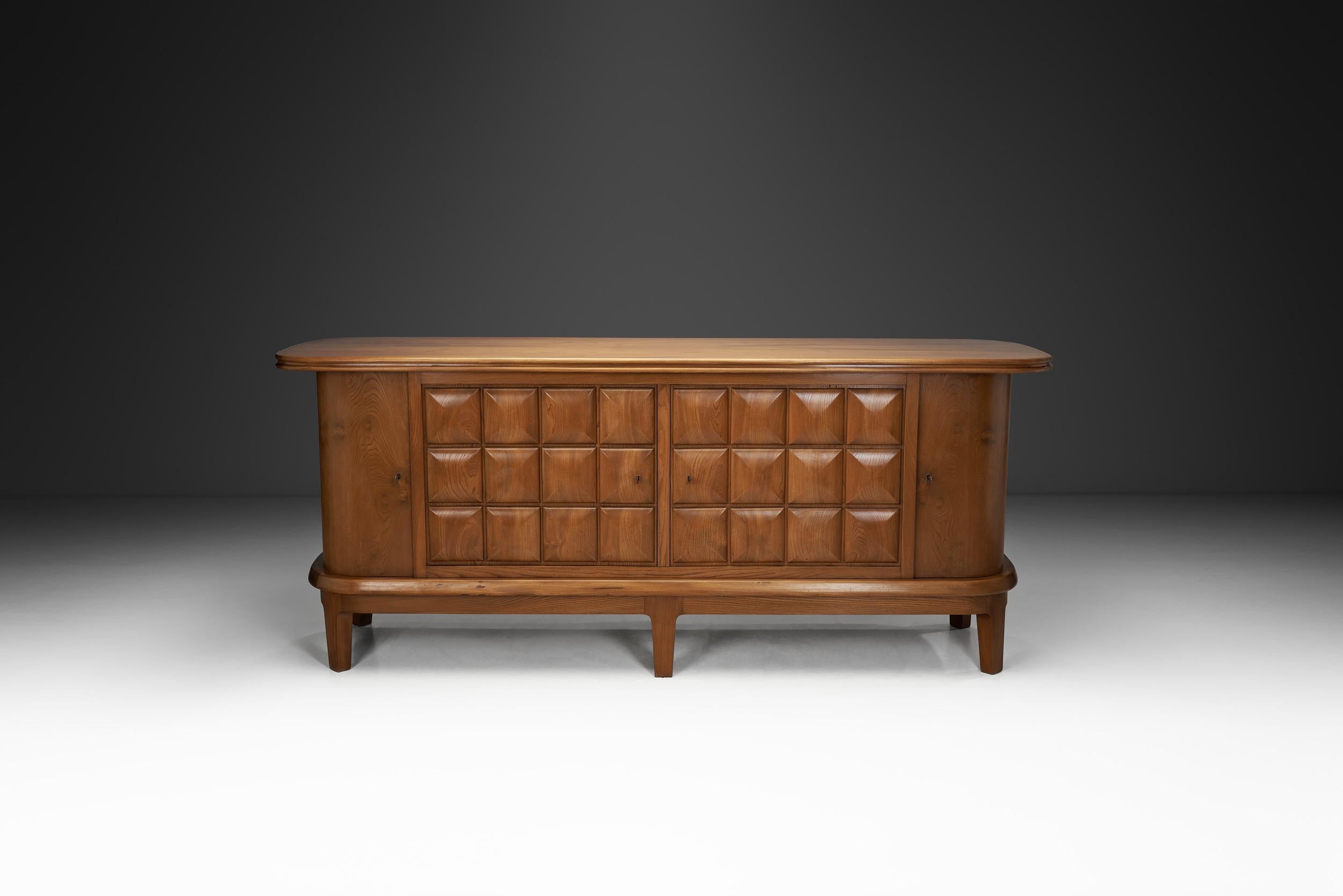 ‎Danish modern, the popular movement that took over the design world, is characterised by clean lines, organic forms, and emphasis on functionality over unnecessary ornamentation. This sideboard beautifully showcases the era’s interest in functional