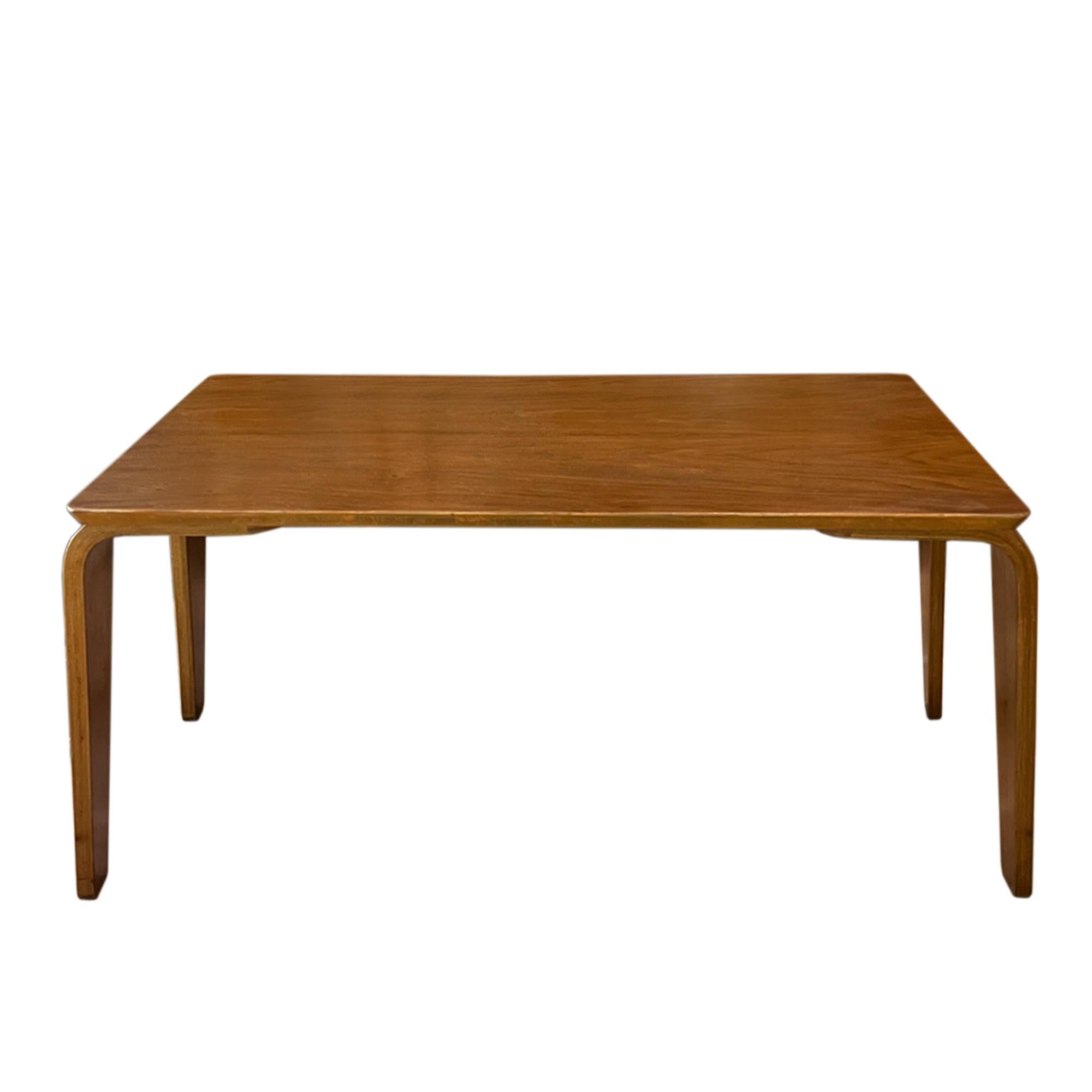 A good sized, super stylish coffee table made in Britain in the 1940s. 

Designed by Eric Lyons (British, 1912 - 1980) it's crafted from elm veneered bent ply, with a rectangular top and tapered legs.

The maker's stamp is retained on the
