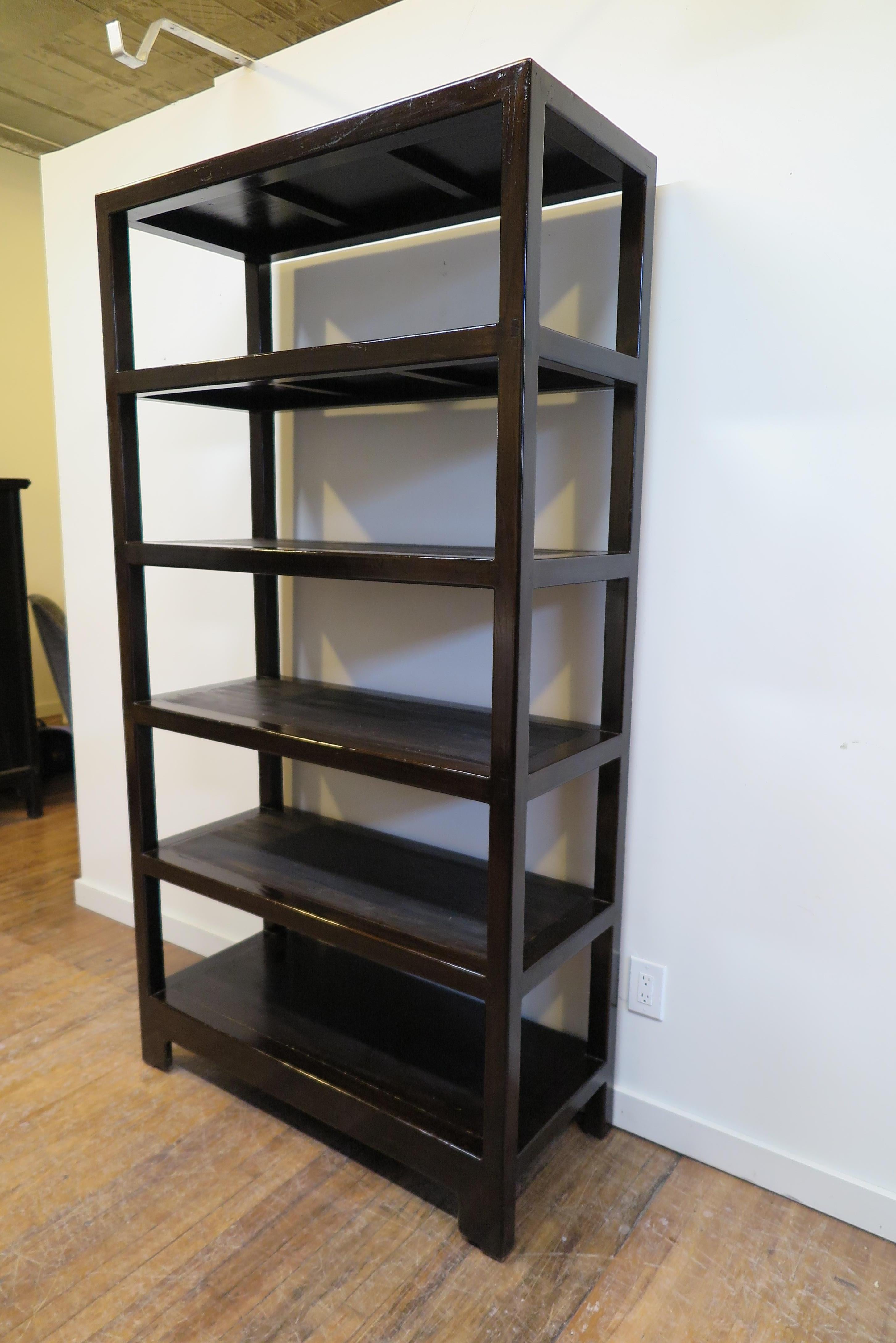 Solid elmwood bookcase, display case, Étagère shelving unit. Late 20th century solid Elm wood, five shelf's all are 12.5 inches high.
Very strong solid wood. Dark brown walnut color. Shelf's are darker. Very good condition.

                    