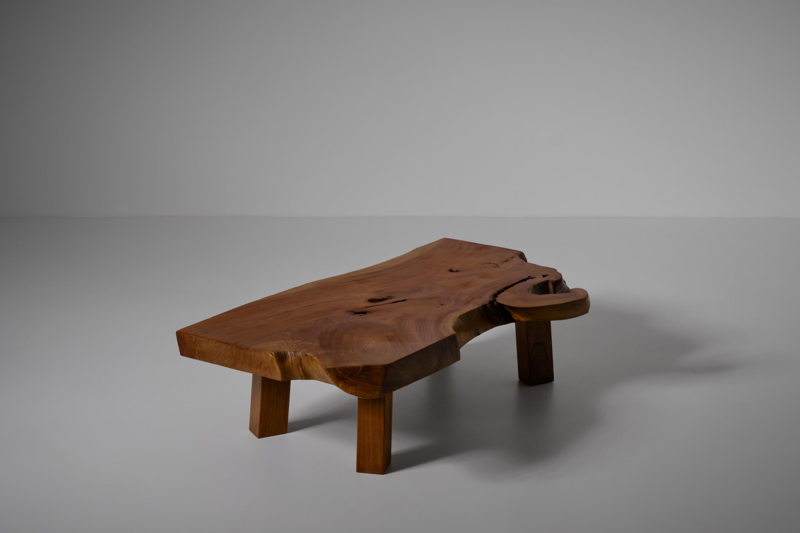 Japanese elm wooden coffee table, Japan 1970s. The table is made from a beautiful slab of Elm wood with an incredible wood grain. The table stands on four strong sturdy block legs.
In very good original condition.