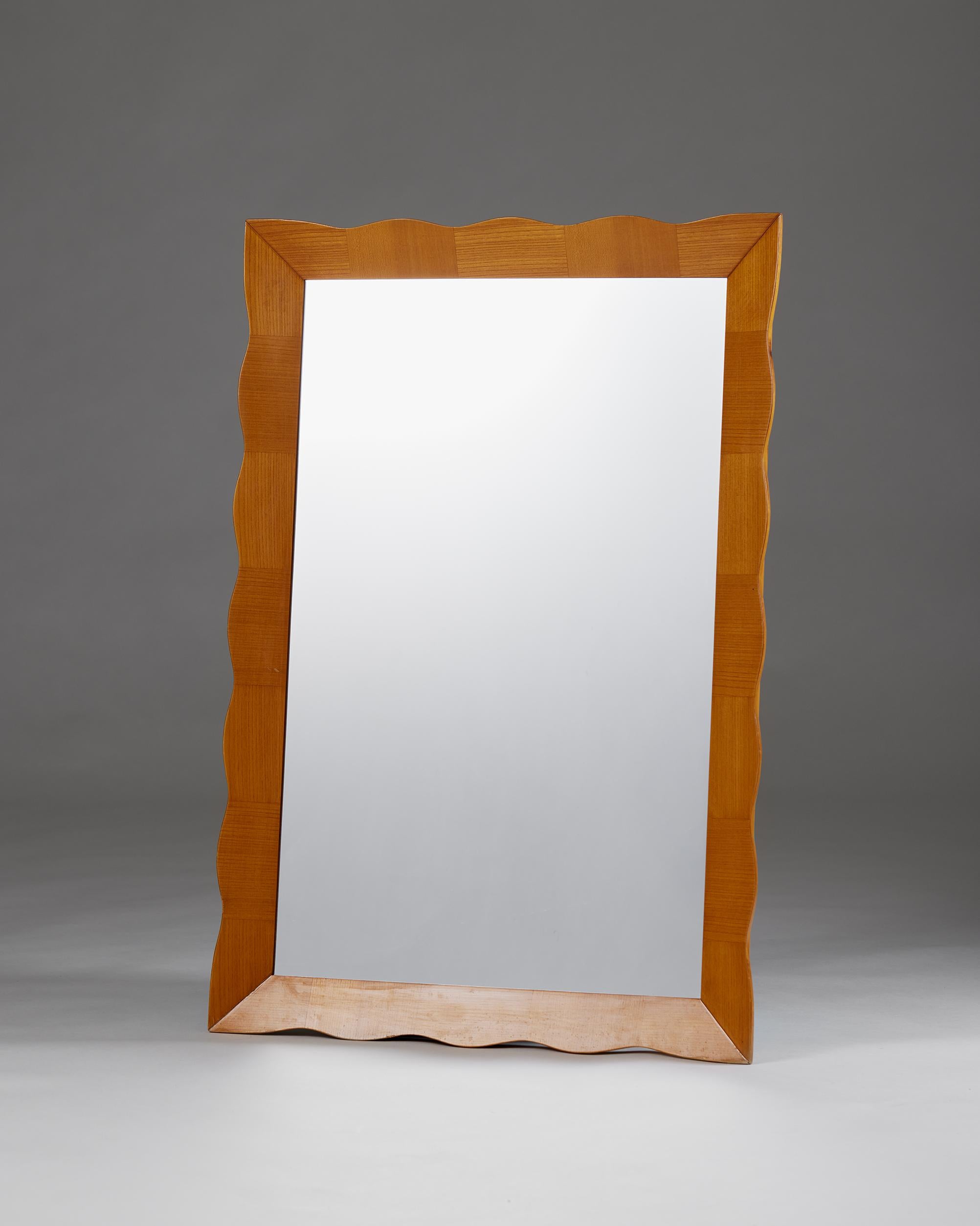 Wave wall mirror, anonymous,
Sweden, 1960s

Elm and mirrored glass.